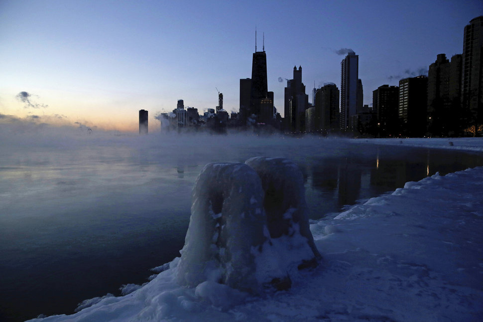 Ice forms along the shore of Lake Michigan, Wednesday, Jan. 30, 2019, in Chicago. A deadly arctic deep freeze enveloped the Midwest with record-breaking temperatures on Wednesday, triggering widespread closures of schools and businesses, and prompting the U.S. Postal Service to take the rare step of suspending mail delivery to a wide swath of the region. (AP Photo/Kiichiro Sato)