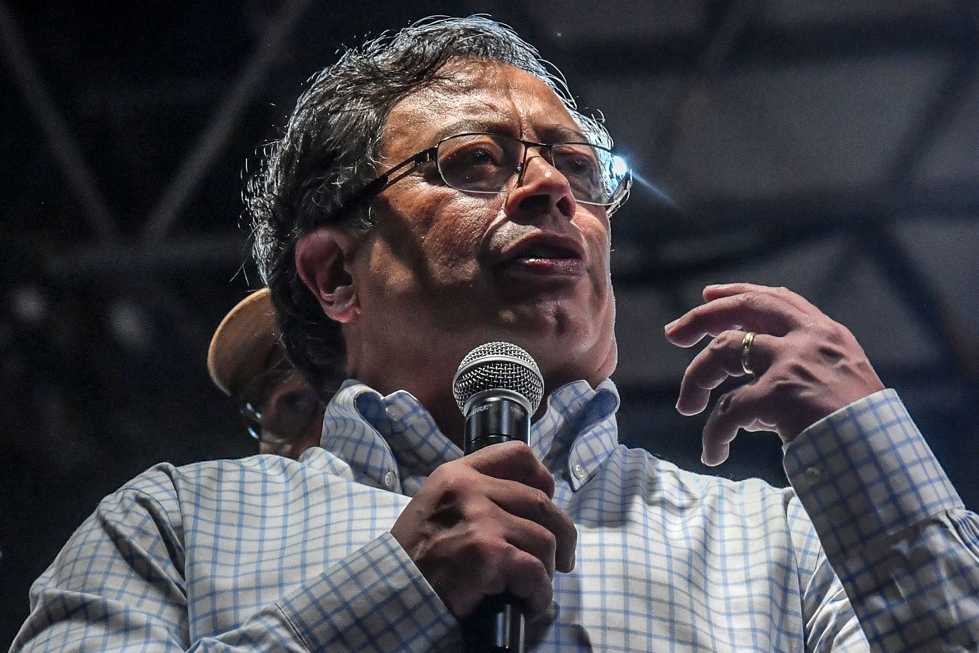 Left-wing Colombian presidential candidate Gustavo Petro delivers a speech during a campaign rally in Medellin, Colombia, May 20, 2022. - Petro is leading in opinion polls for the upcoming presidential election on May 29. (Photo by JOAQUIN SARMIENTO / AFP)