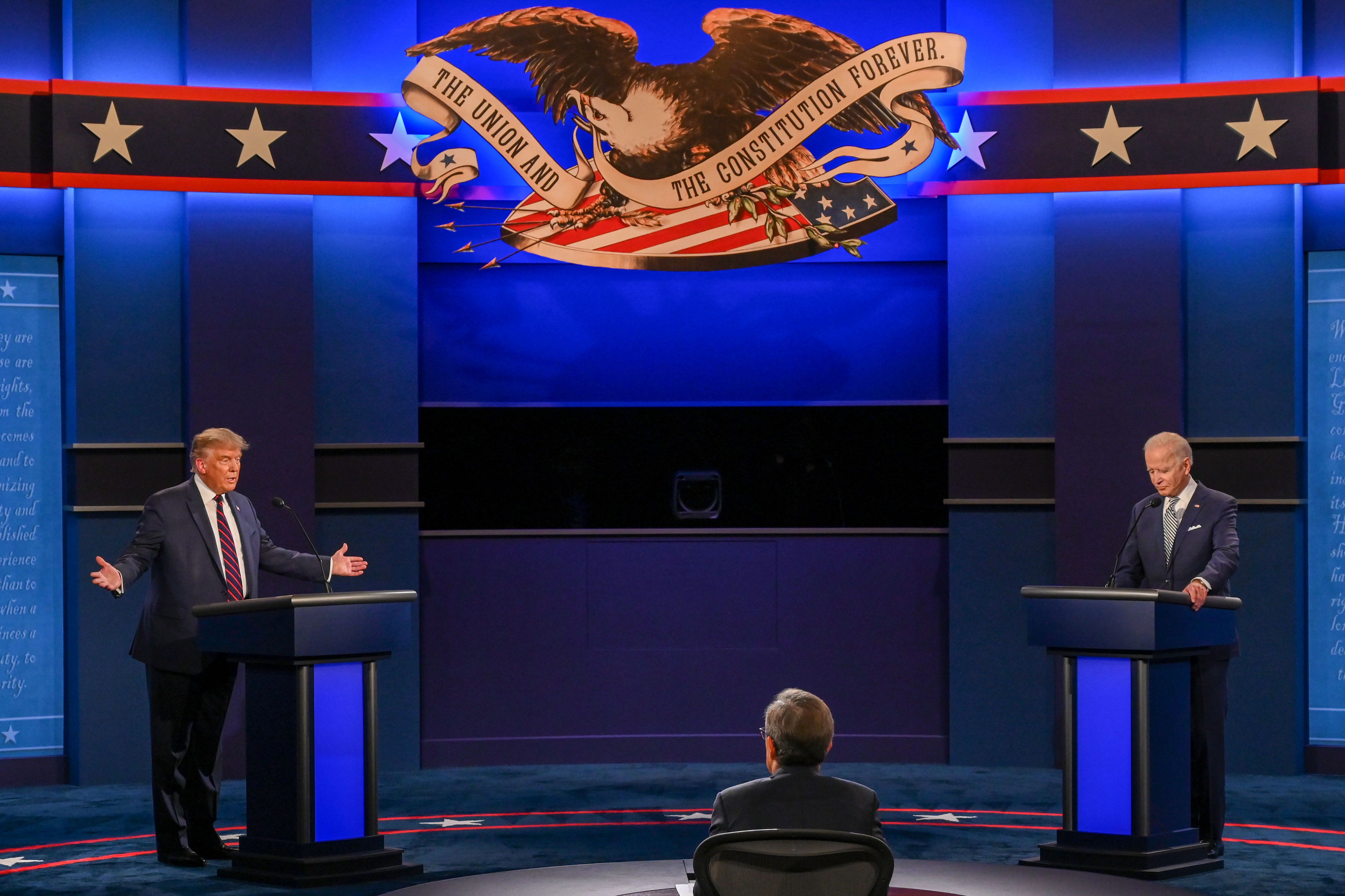 US President Donald Trump (L) and Democratic Presidential candidate and former US Vice President Joe Biden starts exchanging during the first presidential debate at Case Western Reserve University and Cleveland Clinic in Cleveland, Ohio, on September 29, 2020. (Photo by Jim WATSON / AFP)