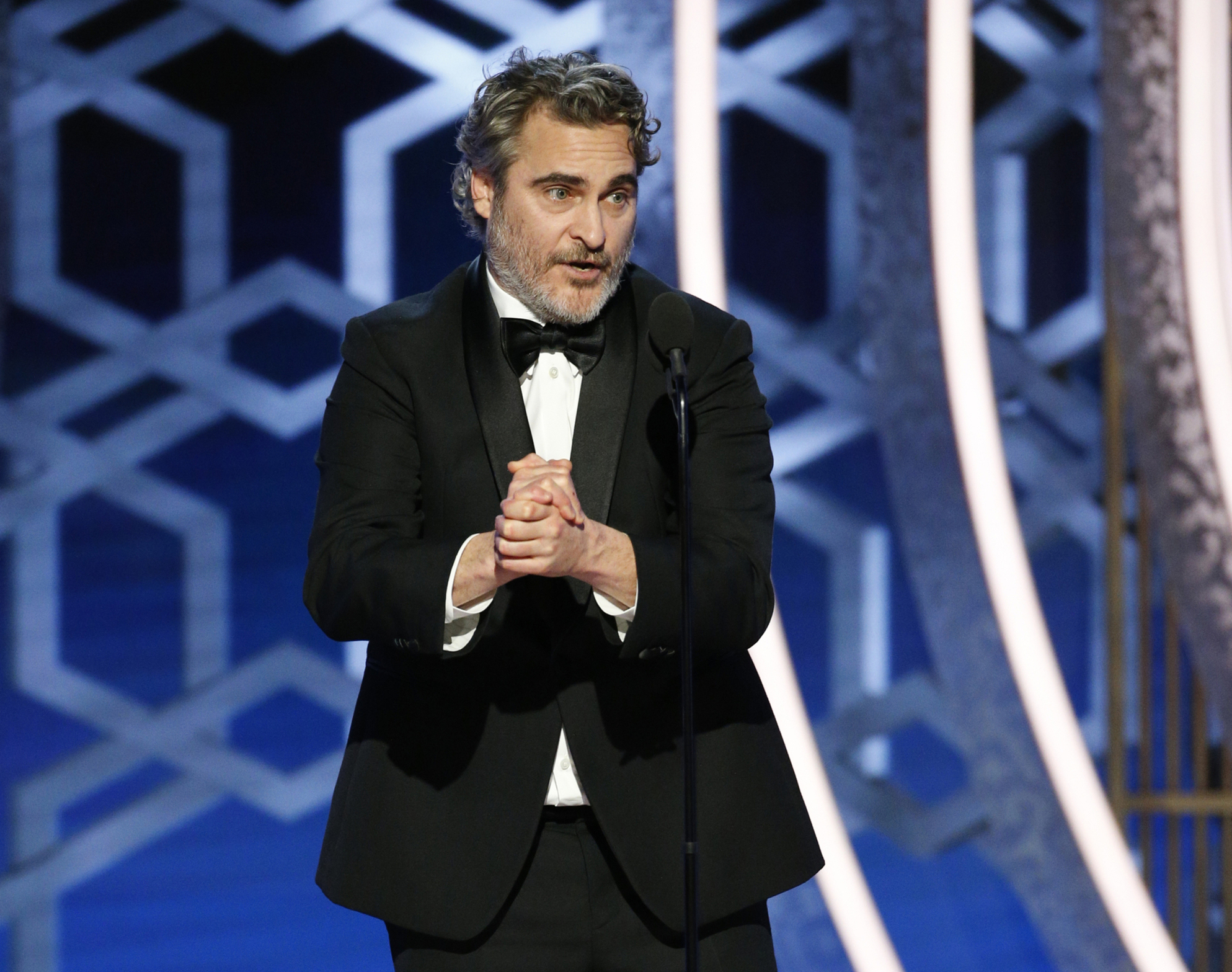 This image released by NBC shows Joaquin Phoenix accepting the award for best actor in a motion picture drama for his role in "Joker" at the 77th Annual Golden Globe Awards at the Beverly Hilton Hotel in Beverly Hills, Calif., on Sunday, Jan. 5, 2020. (Paul Drinkwater/NBC via AP)