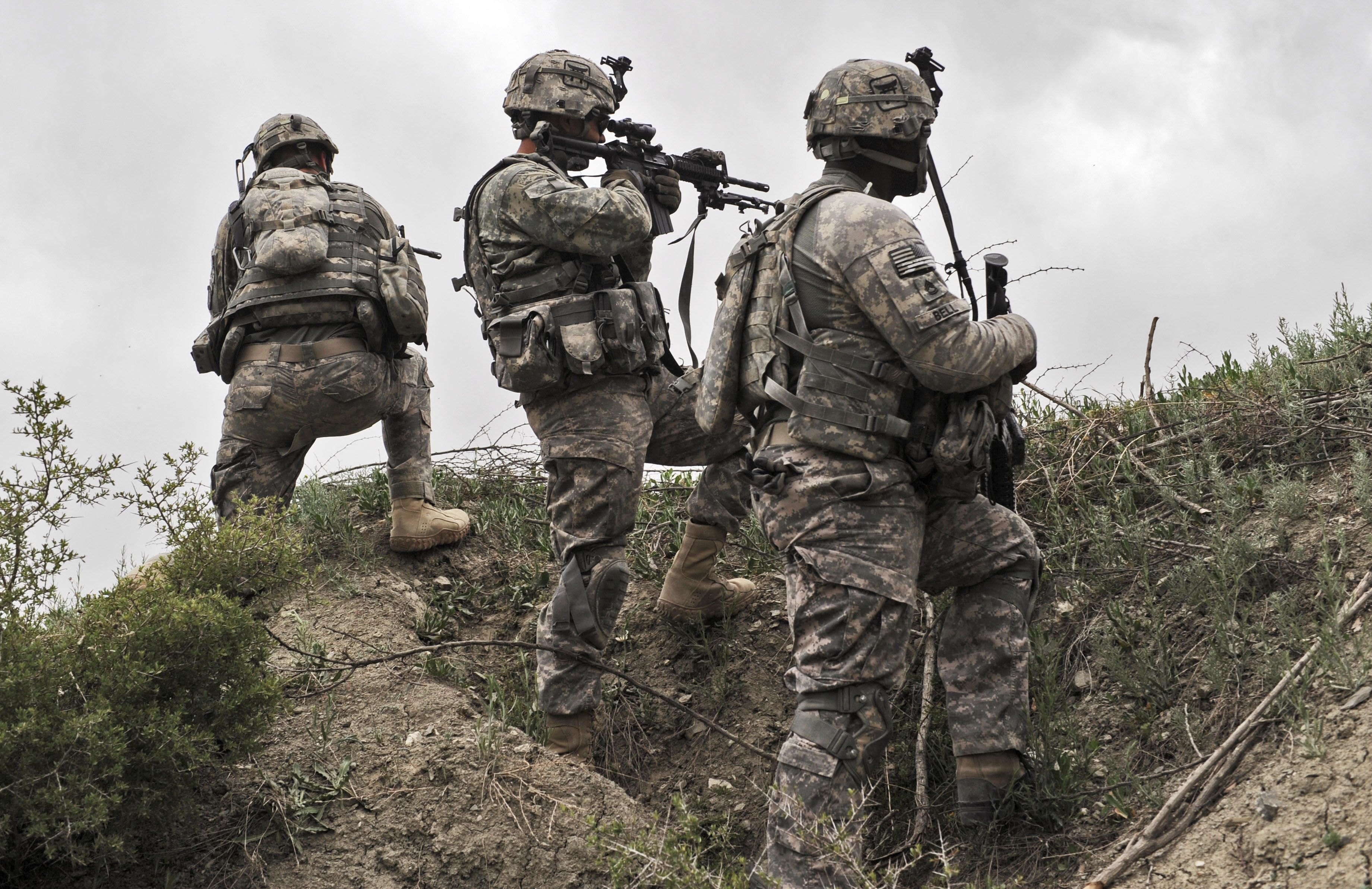 (FILES) In this file photo US soldiers from Second Platoon, Bravo Troop, 33rd Cavalry, 3rd Brigade Combat Team take position during a patrol in Ibrahim Khel village of Khost province on April 11, 2010. - President Joe Biden will remove all US troops from Afghanistan before this year's 20th anniversary of the September 11 attacks, ending America's longest war around five months later than planned, a US official said.
Biden has "reached the conclusion that the United States will complete its drawdown -- will remove its forces from Afghanistan -- before September 11," the official told reporters on condition of anonymity. (Photo by MASSOUD HOSSAINI / AFP)