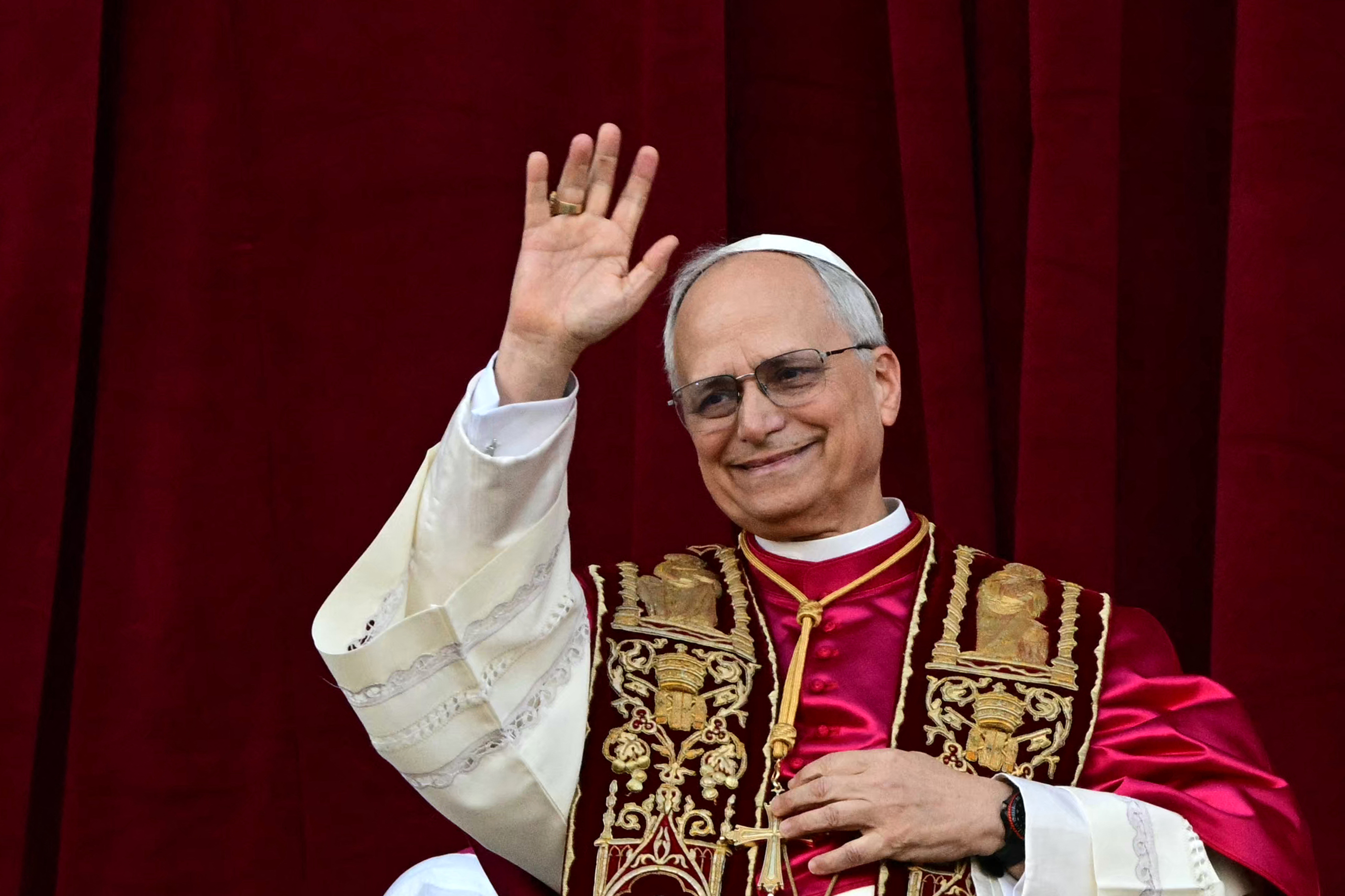 Newly elected Pope Leo XIV, Robert Prevost addresses the crowd on the main central loggia balcony of the St Peter's Basilica for the first time, after the cardinals ended the conclave, in The Vatican, on May 8, 2025. Robert Francis Prevost was on Thursday elected the first pope from the United States, the Vatican announced. A moderate who was close to Pope Francis and spent years as a missionary in Peru, he becomes the Catholic Church's 267th pontiff, taking the papal name Leo XIV. (Photo by Tiziana FABI / AFP)