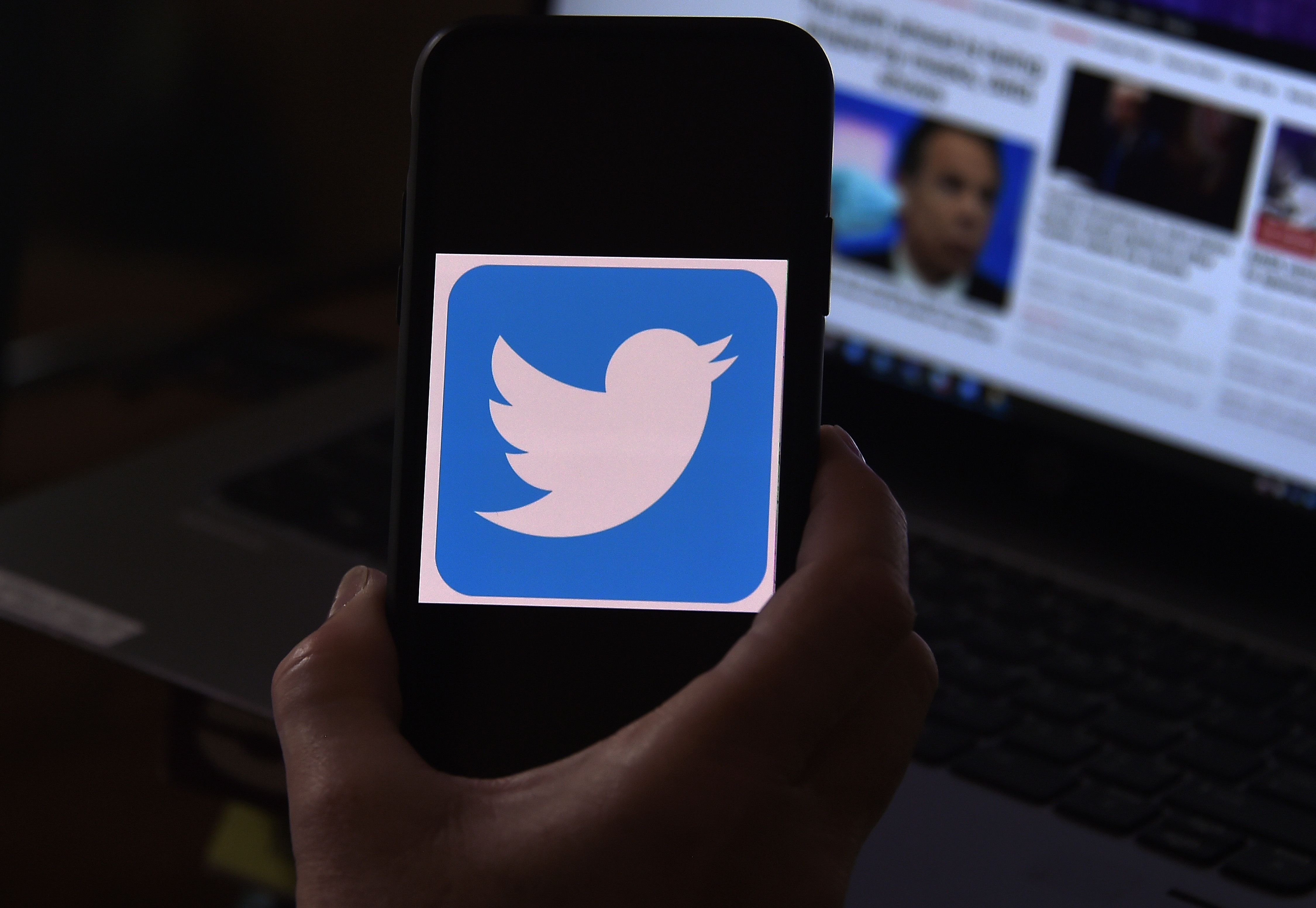 (FILES) In this file photo illustration, a Twitter logo is displayed on a mobile phone on May 27, 2020, in Arlington, Virginia. - Twitter on January 6 began limiting the reach of tweets stoking an assault of the US Capitol by a mob intent on overturning the election results.
"We have been significantly restricting engagement with tweets labeled under our Civic Integrity Policy due to the risk of violence," the Twitter support team said. (Photo by Olivier DOULIERY / AFP)