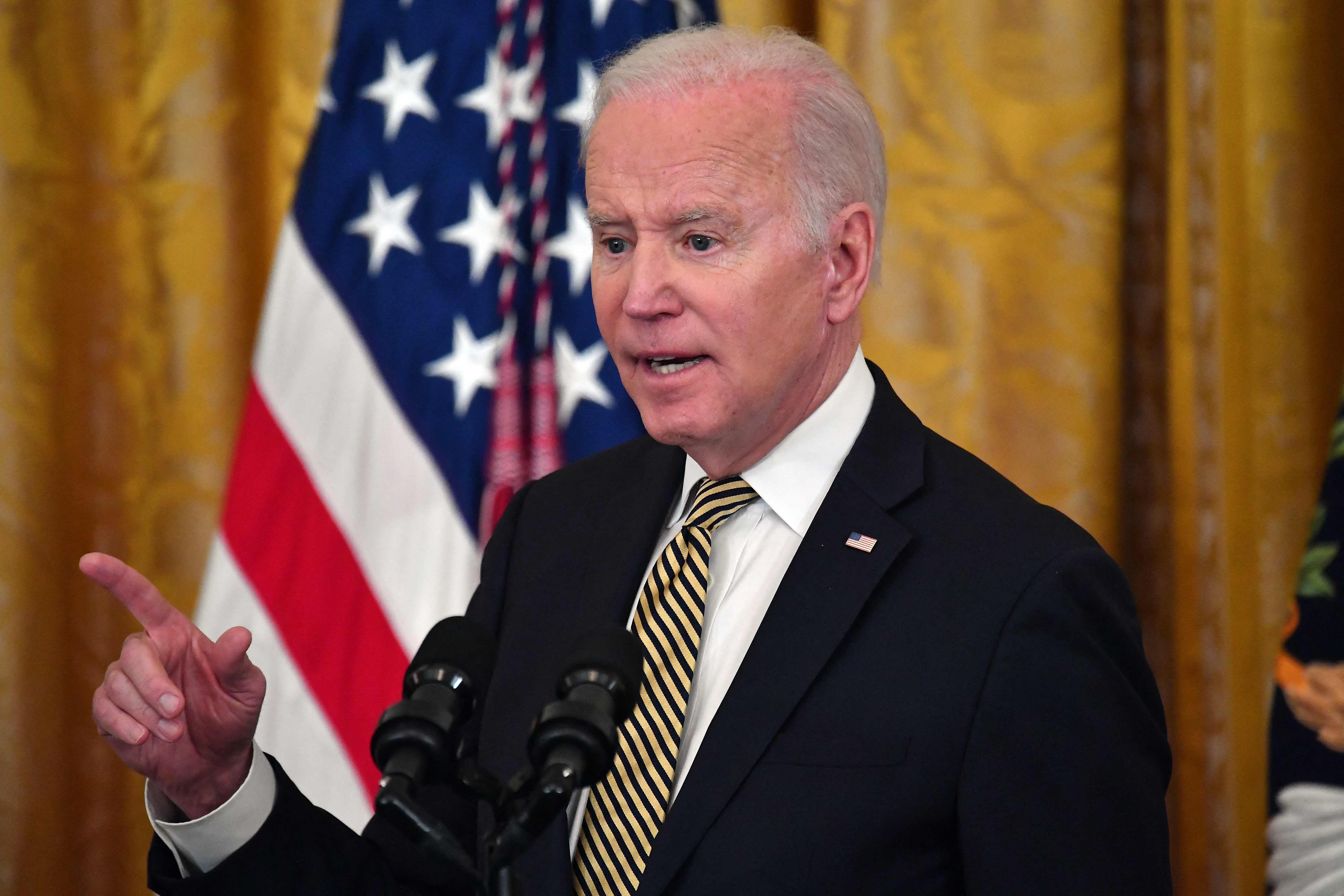 US President Joe Biden speaks during an event celebrating the reauthorization of the Violence Against Women Act, in the East Room of the White House in Washington, DC, on March 16, 2022. (Photo by Nicholas Kamm / AFP)