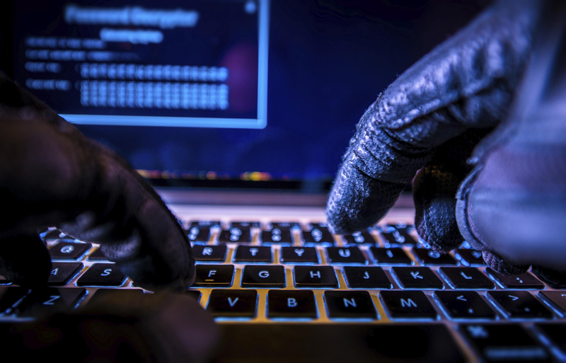 Payments System Hacking. Online Credit Cards Payment Security Concept. Hacker in Black Gloves Hacking the System.