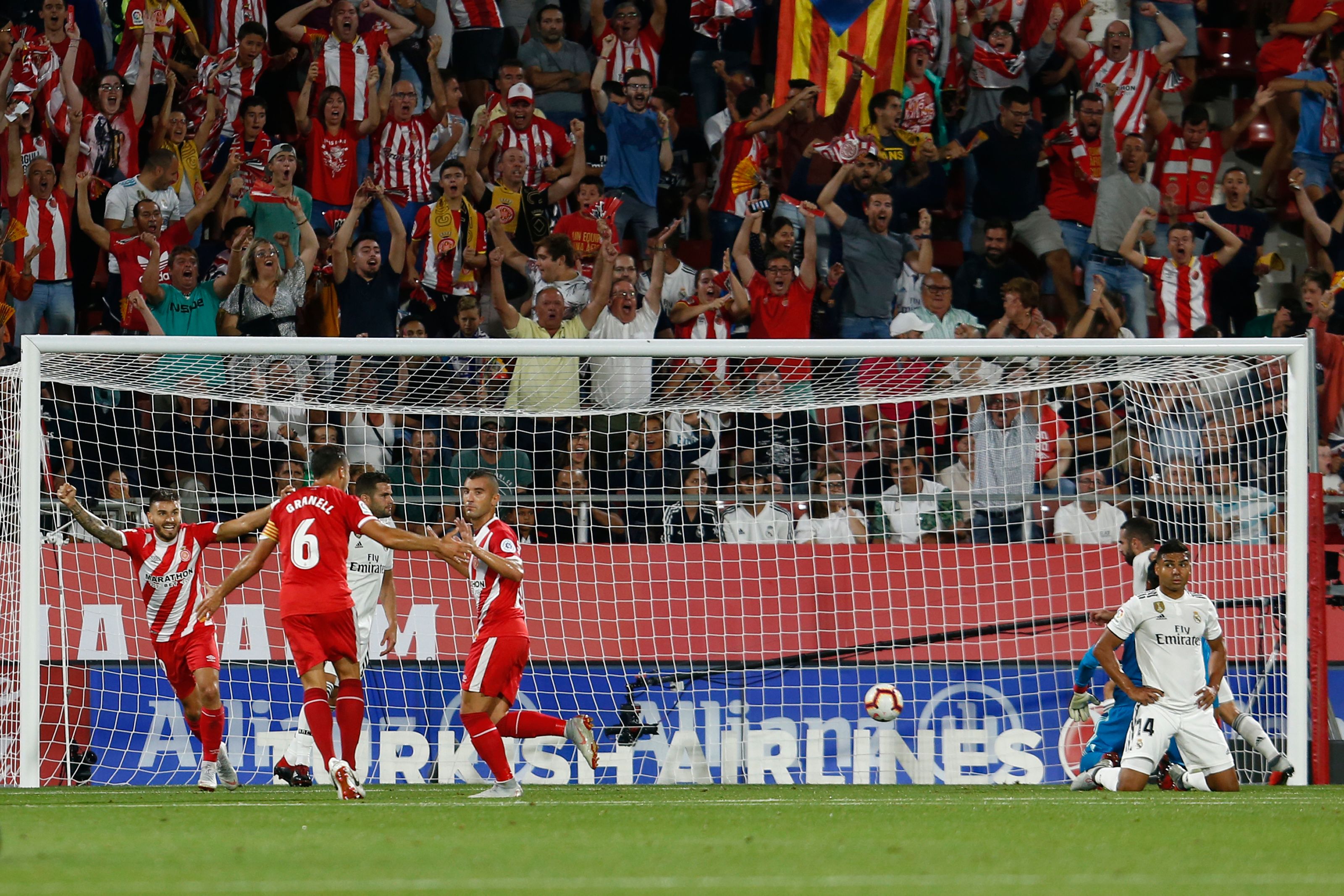 Girona's Spanish midfielder Borja Garcia (4L) celebrates the opening goal during the Spanish league football match between Girona FC and Real Madrid CF at the Montilivi stadium in Girona on August 26, 2018. (Photo by Pau BARRENA CAPILLA / AFP)