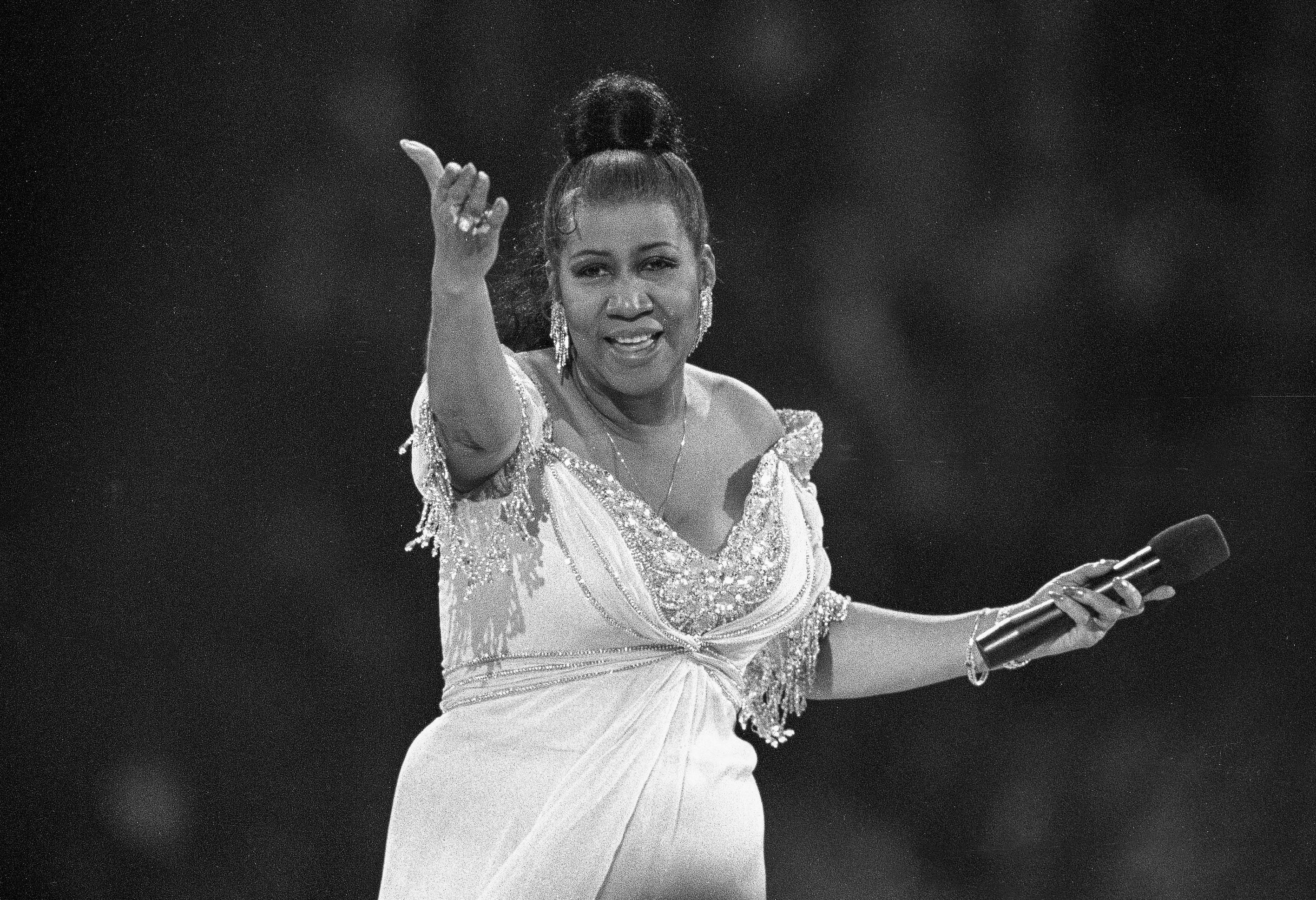 FILE - In this Jan. 19, 1993 file photo, singer Aretha Franklin performs at the inaugural gala for President Bill Clinton in Washington. Franklin died on Aug. 16, 2018, at her home in Detroit. She was 76. Franklin and Sen. John McCain lived through the decade that reshaped so much of American life but were propelled into the 1970s and all the way to 2018, carrying some of the fundamental storylines of the 1960s as they hurtled forward. (AP Photo/Amy Sancetta, File)