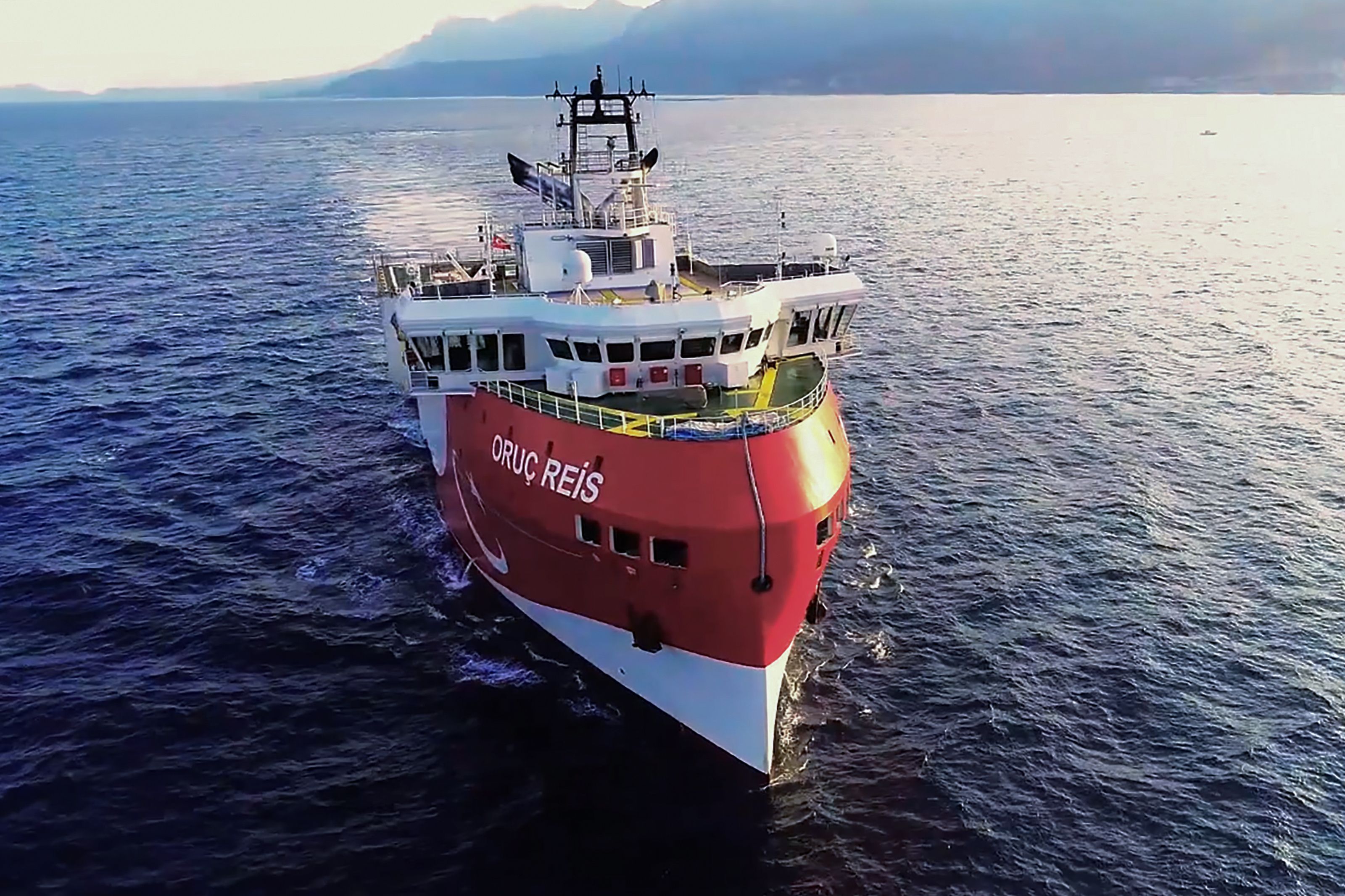 This handout photograph released by the Turkish Defence Ministry on August 12, 2020, shows Turkish seismic research vessel 'Oruc Reis' heading in the west of Antalya on the Mediterranean Sea. - Greek Prime Minister on August 12, 2020 urged Turkey to show "logic" in a naval showdown in the Eastern Mediterranean over energy exploration which he warned could lead to a military accident. Tensions were stoked on August 10 when Ankara dispatched the research ship Oruc Reis accompanied by Turkish naval vessels off the Greek island of Kastellorizo in the eastern Mediterranean. (Photo by Handout / TURKISH DEFENCE MINISTRY / AFP) / RESTRICTED TO EDITORIAL USE - MANDATORY CREDIT "AFP PHOTO / HO / TURKISH DEFENCE MINISTRY" - NO MARKETING - NO ADVERTISING CAMPAIGNS - DISTRIBUTED AS A SERVICE TO CLIENTS