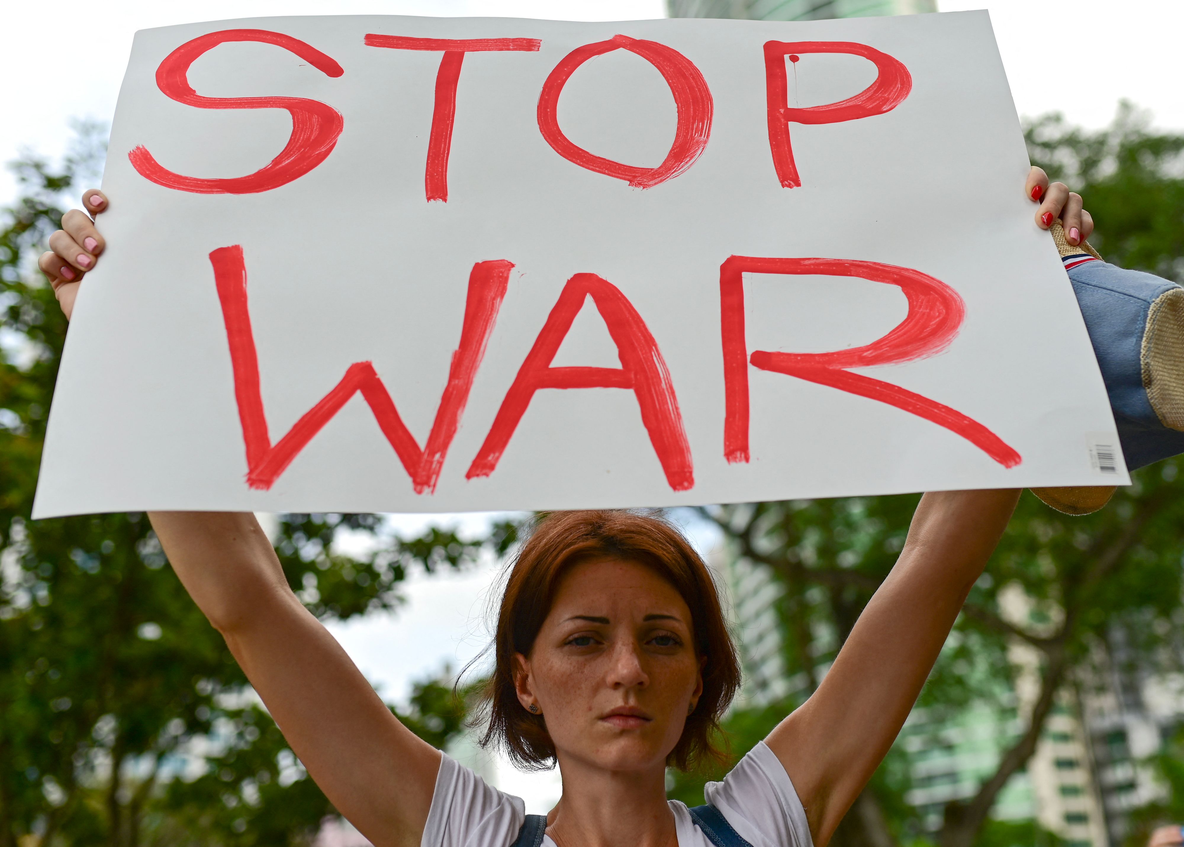 Members of the Ukrainian community take part in a demonstration against the Russian invasion in Ukraine at the Urraca park in Panama City, on March 19, 2022. (Photo by Luis ACOSTA / AFP)