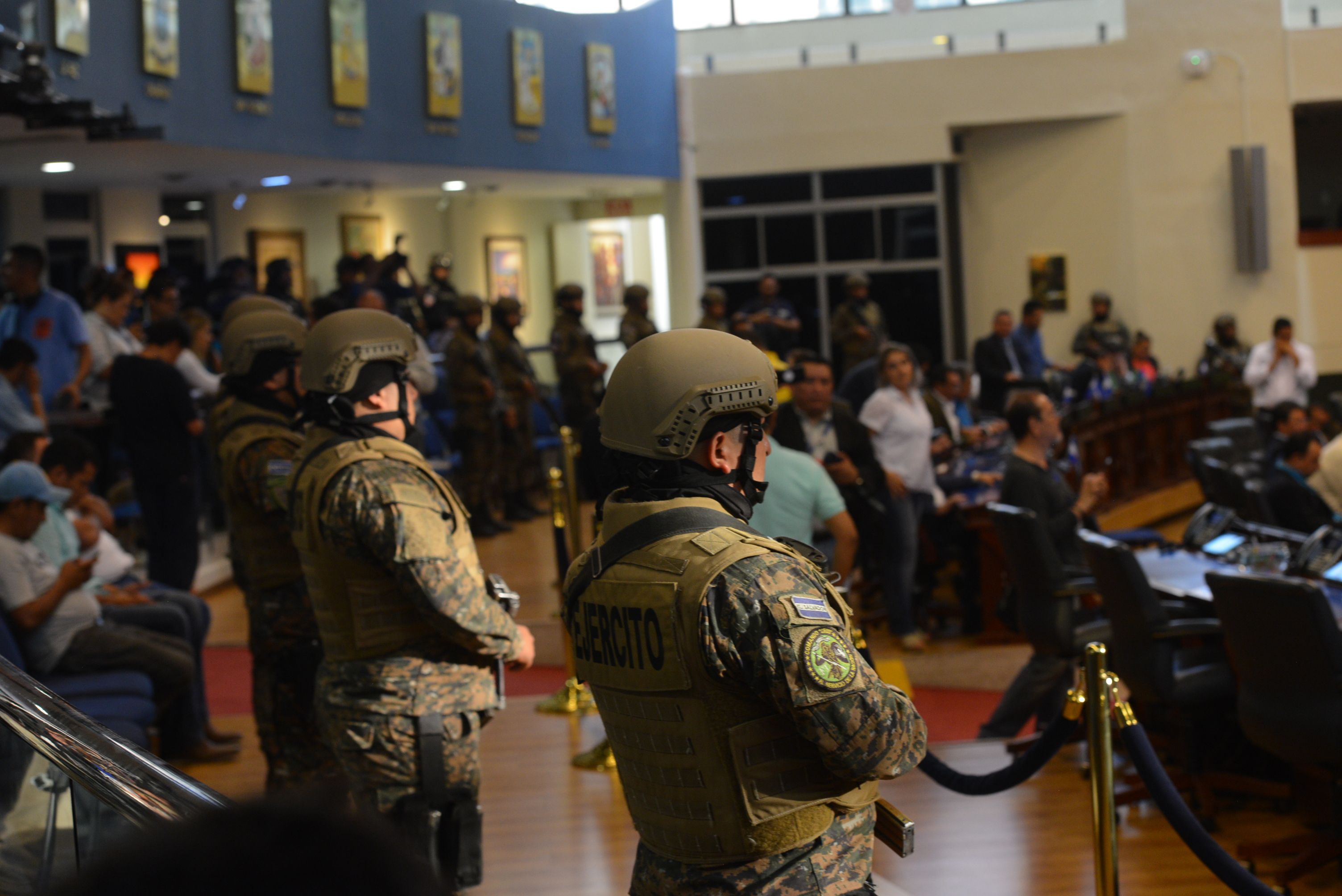Members of the Salvadoran Armed Forces are seen within the Legislative Assembly during a protest outside the Legislative Assembly to make pressure on deputies to approve a loan to invest in security, in San Salvador on February 9, 2020. (Photo by STR / AFP)