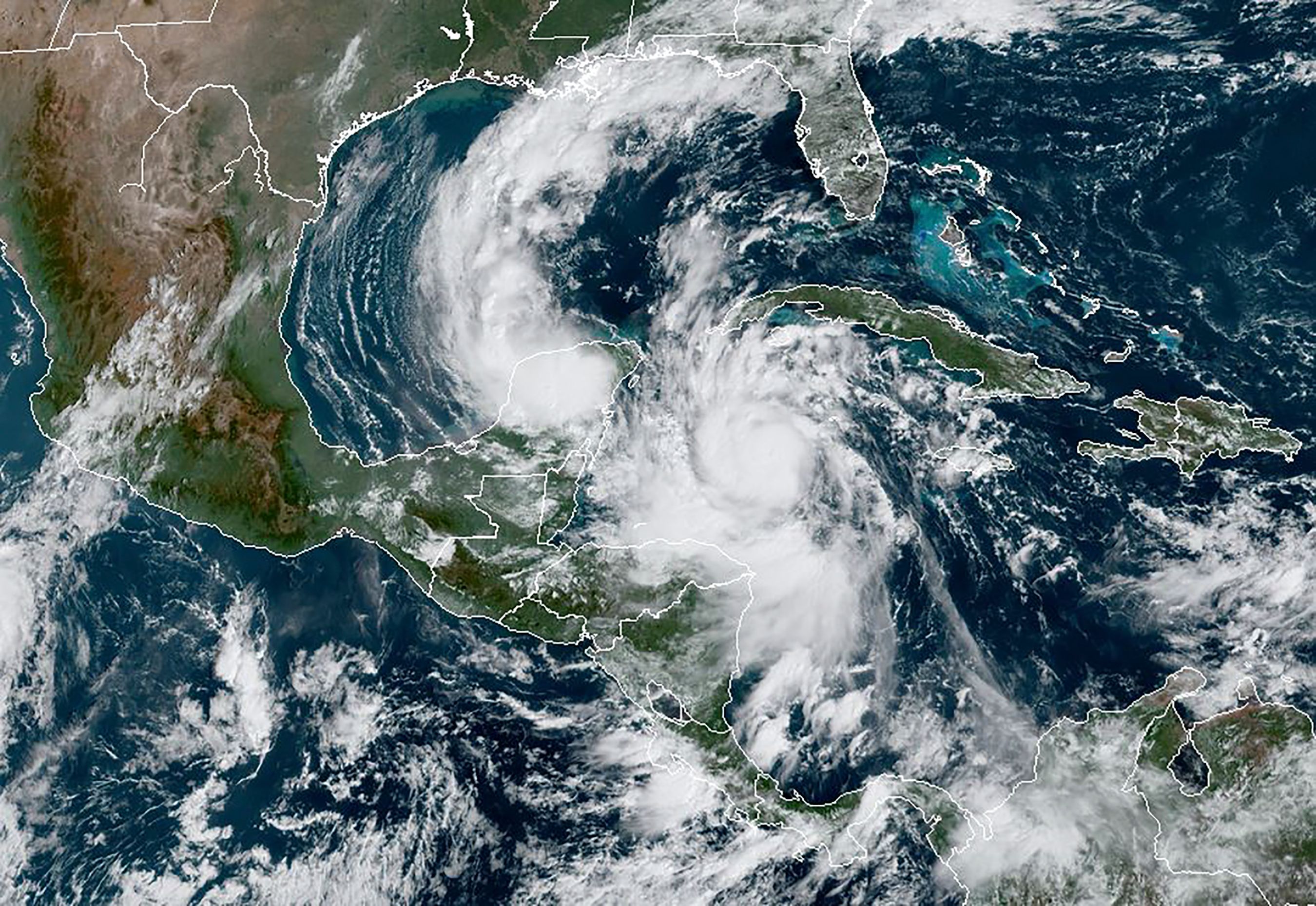 This RAMMB/NOAA satellite image shows Hurricane Delta moving northwest in the Caribbean on October 6, 2020, at 15:20 UTC. - Hurricane Delta intensified rapidly into a Category 4 storm on October 6, 2020 and is set to slam into Mexico's Yucatan Peninsula early on October 7, 2020, the US National Hurricane Center said. Maximum sustained winds increased to 130 miles (215 kilometers) per hour, and the storm is "forecast to be an extremely dangerous" hurricane when it makes landfall, the center said. (Photo by Handout / RAMMB/NOAA/NESDIS / AFP) / RESTRICTED TO EDITORIAL USE - MANDATORY CREDIT "AFP PHOTO / RAMMB/NOAA" - NO MARKETING - NO ADVERTISING CAMPAIGNS - DISTRIBUTED AS A SERVICE TO CLIENTS