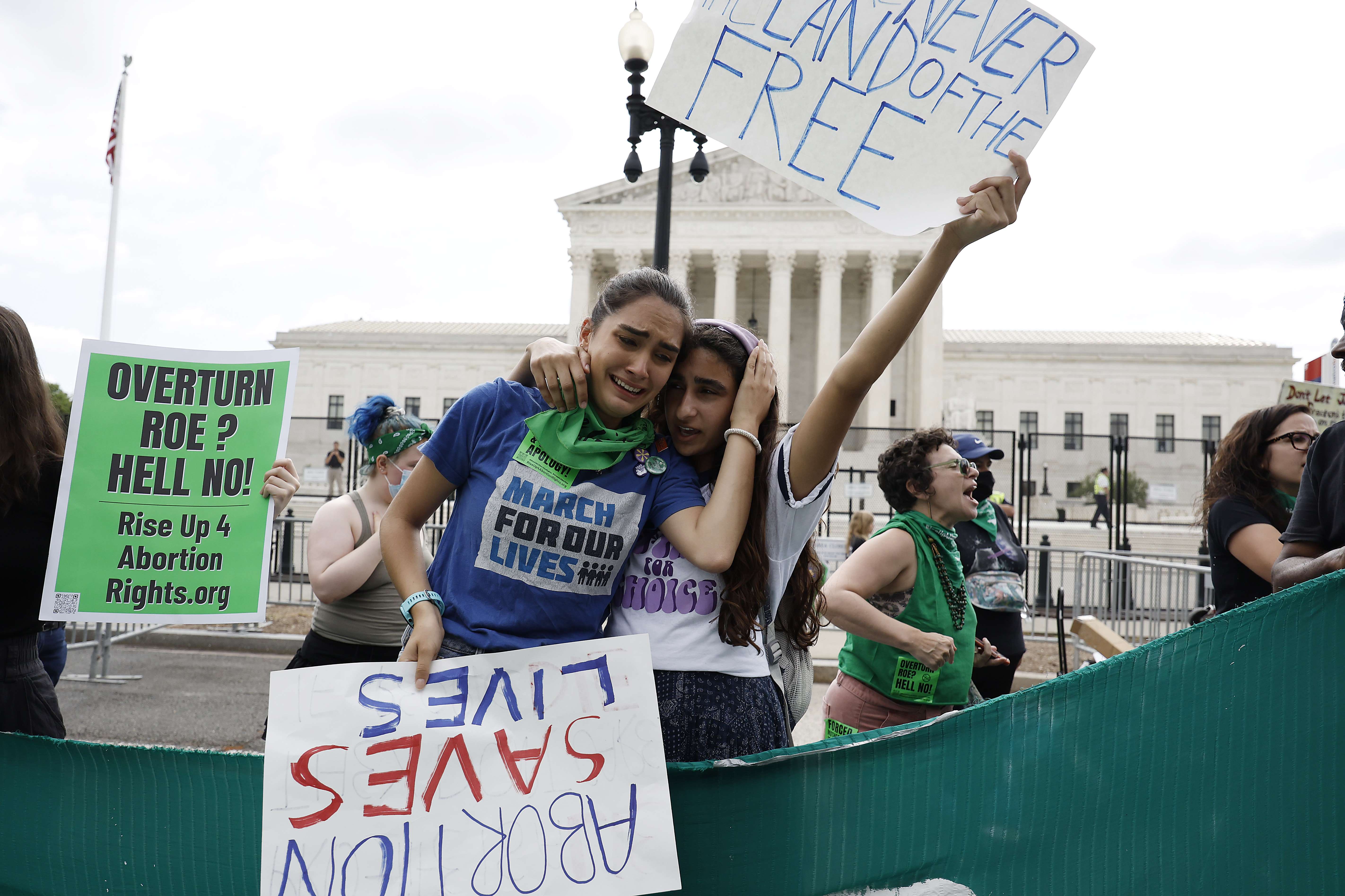 WASHINGTON, DC - JUNE 24: Pro-life activists react to the Dobbs v Jackson Women�s Health Organization ruling which overturns the landmark abortion Roe v. Wade case in front of the U.S. Supreme Court on June 24, 2022 in Washington, DC. Anna Moneymaker/Getty Images