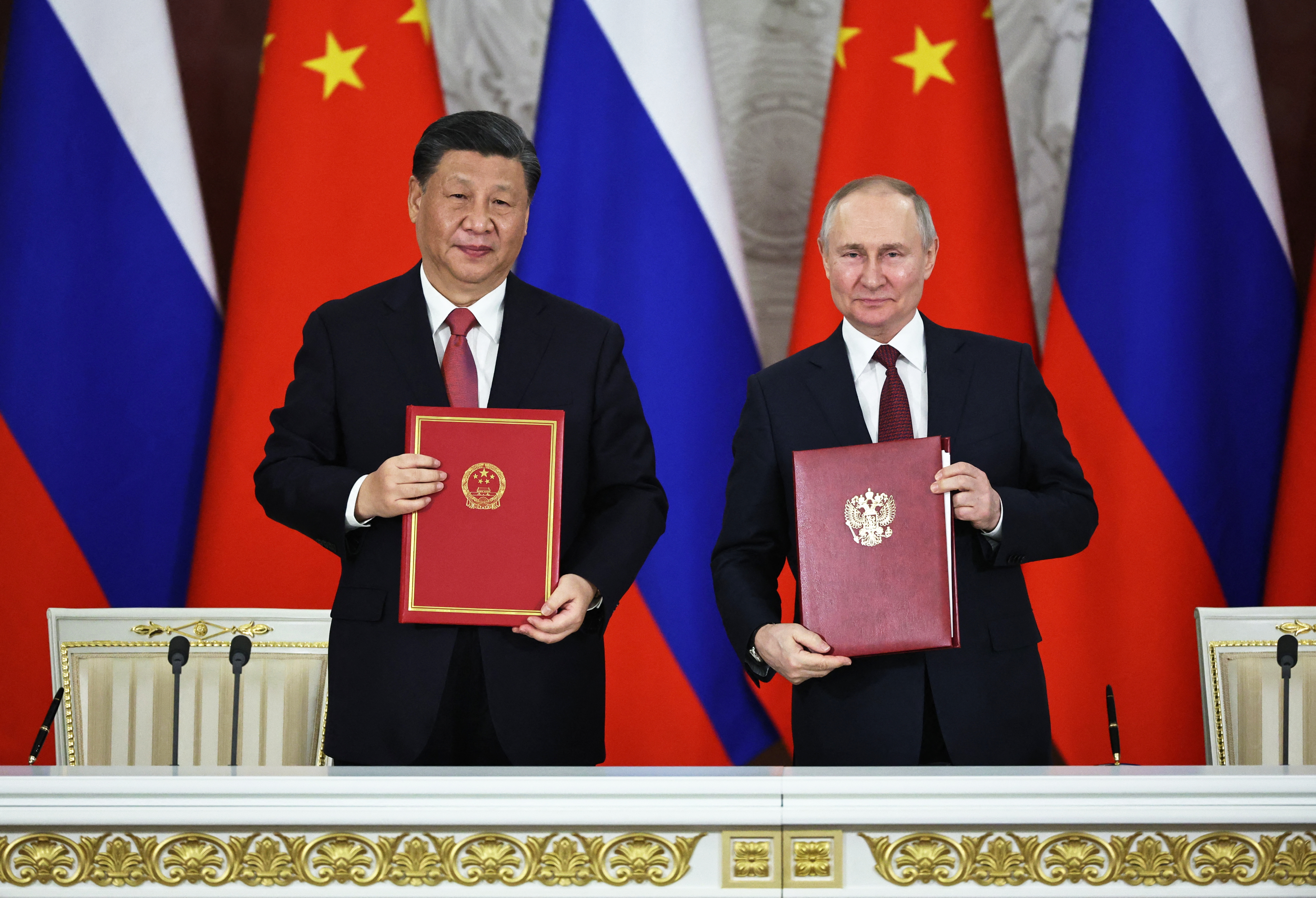 Russian President Vladimir Putin and China's President Xi Jinping attend a signing ceremony following their talks at the Kremlin in Moscow on March 21, 2023. (Photo by Mikhail TERESHCHENKO / SPUTNIK / AFP)