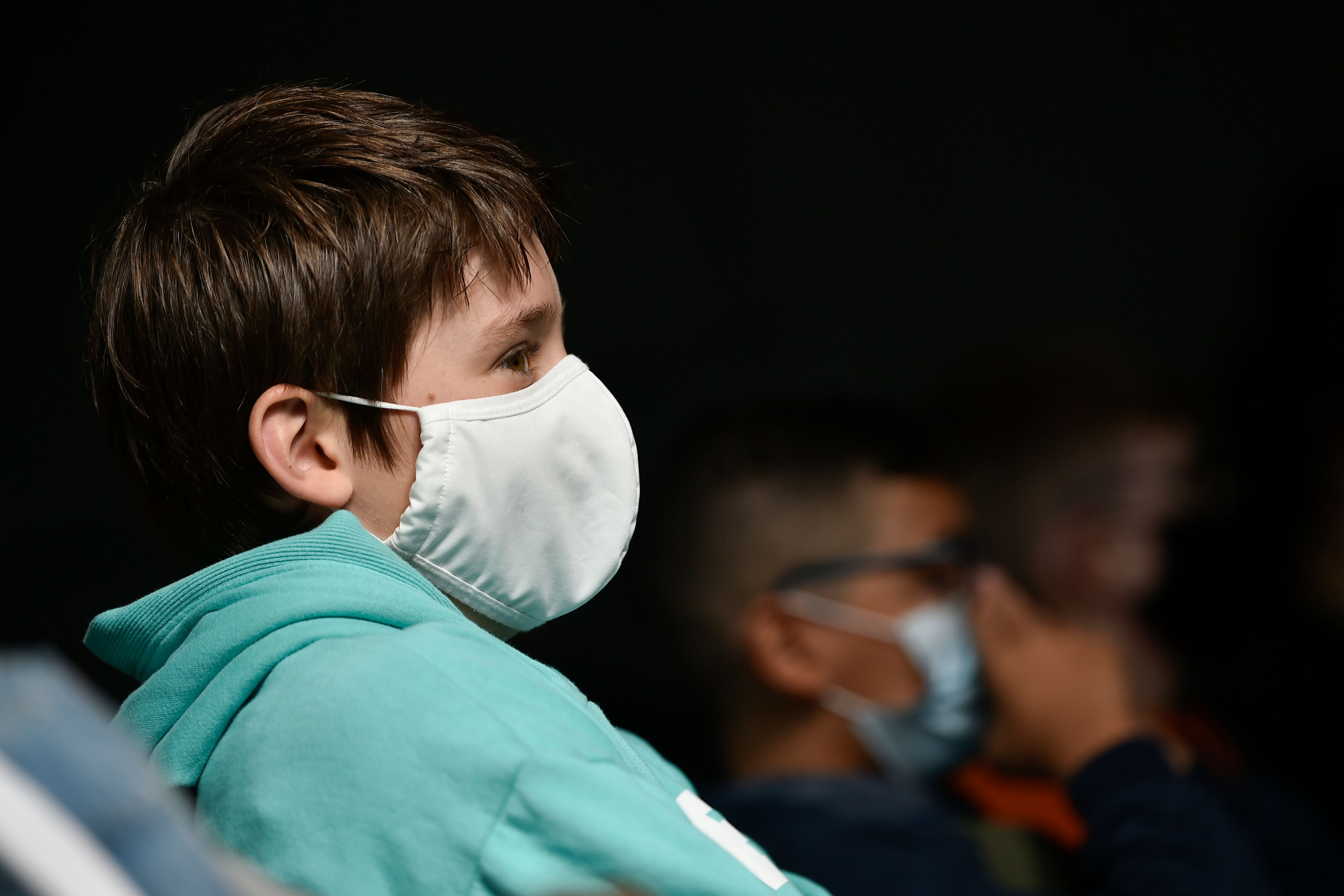 Martin Collinge wearing a protective mask attends a class at the Sacre Coeur de Lindthout secondary school, in Brussels, on September 1, 2020. - Six months after schools closed due to the pandemic, millions of students from France, Belgium or Great Britain make their return to school on September 1, in schools that have had to completely reorganize themselves to avoid the spread of Covid-19. The little French, Belgian and British children open the traditional September ball. Their German, Northern Irish or Scottish peers, in particular, preceded them in August. (Photo by JOHN THYS / AFP)