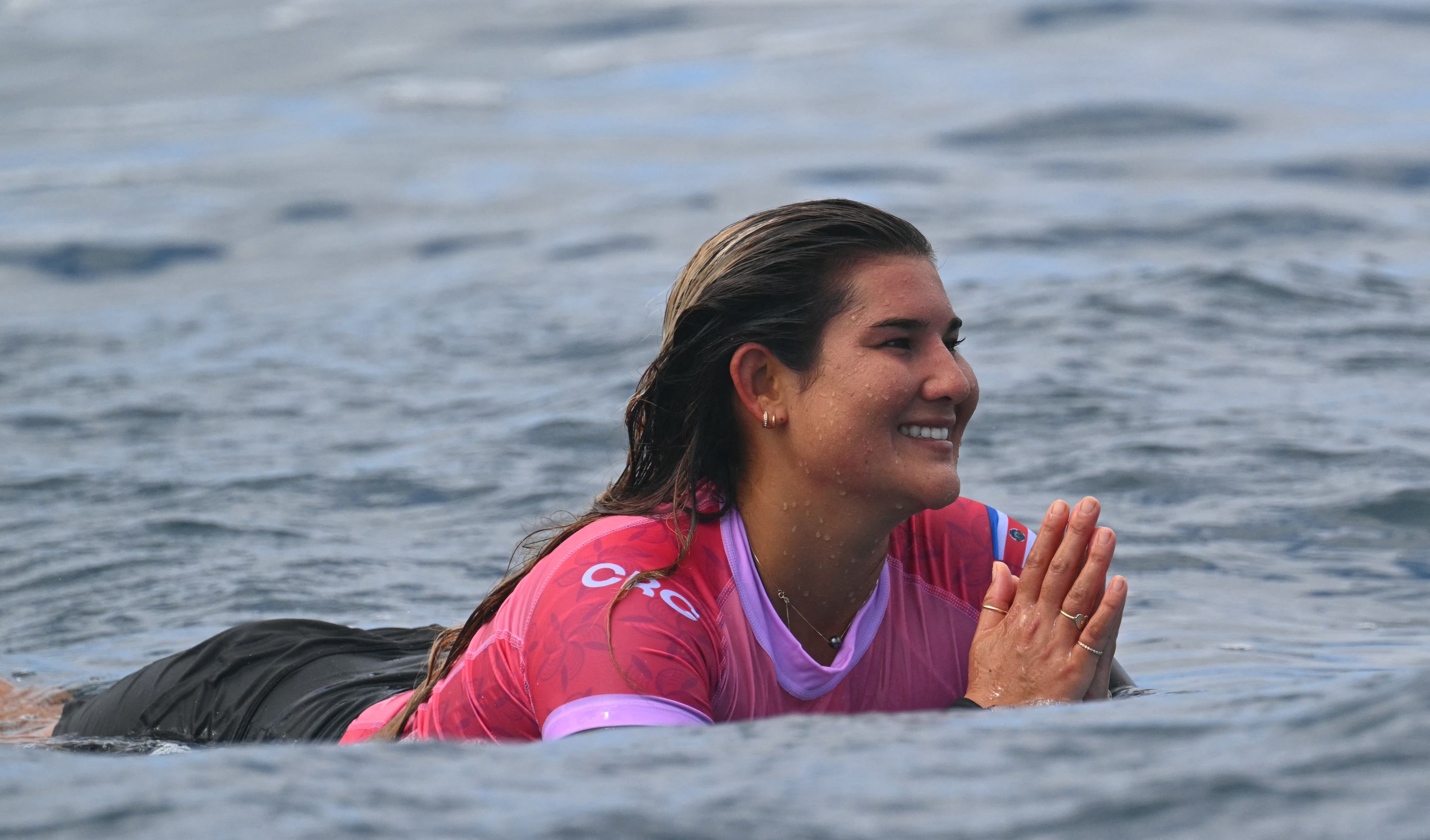 Costa Rica's Brisa Hennessy reacts after her heat in the women's surfing round 3, during the Paris 2024 Olympic Games, in Teahupo'o, on the French Polynesian Island of Tahiti, on August 1, 2024. (Photo by Jerome BROUILLET / AFP)