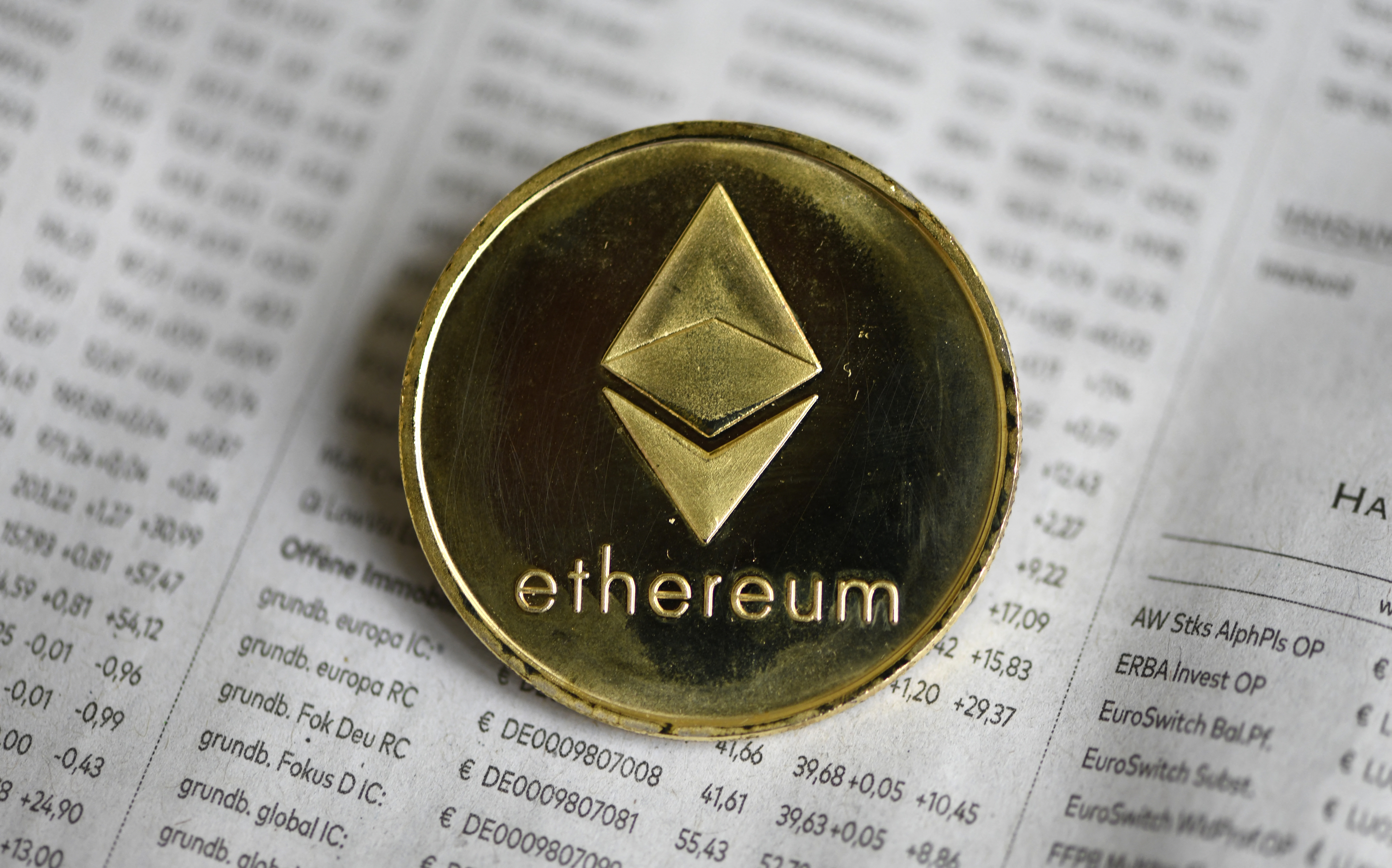 (FILES) In this file photo taken on January 27, 2020 The photo shows a physical imitation of a Ethereum cryptocurrency in Dortmund, western Germany. - An army of computer programmers scattered across the globe is set to attempt one of the biggest software upgrades the crypto sector has ever seen later this week. Developers have spent years working on a more energy-efficient version of the ethereum blockchain, a digital ledger that underpins a multibillion dollar ecosystem of cryptocurrencies, digital tokens (NFTs), games and apps. (Photo by INA FASSBENDER / AFP)