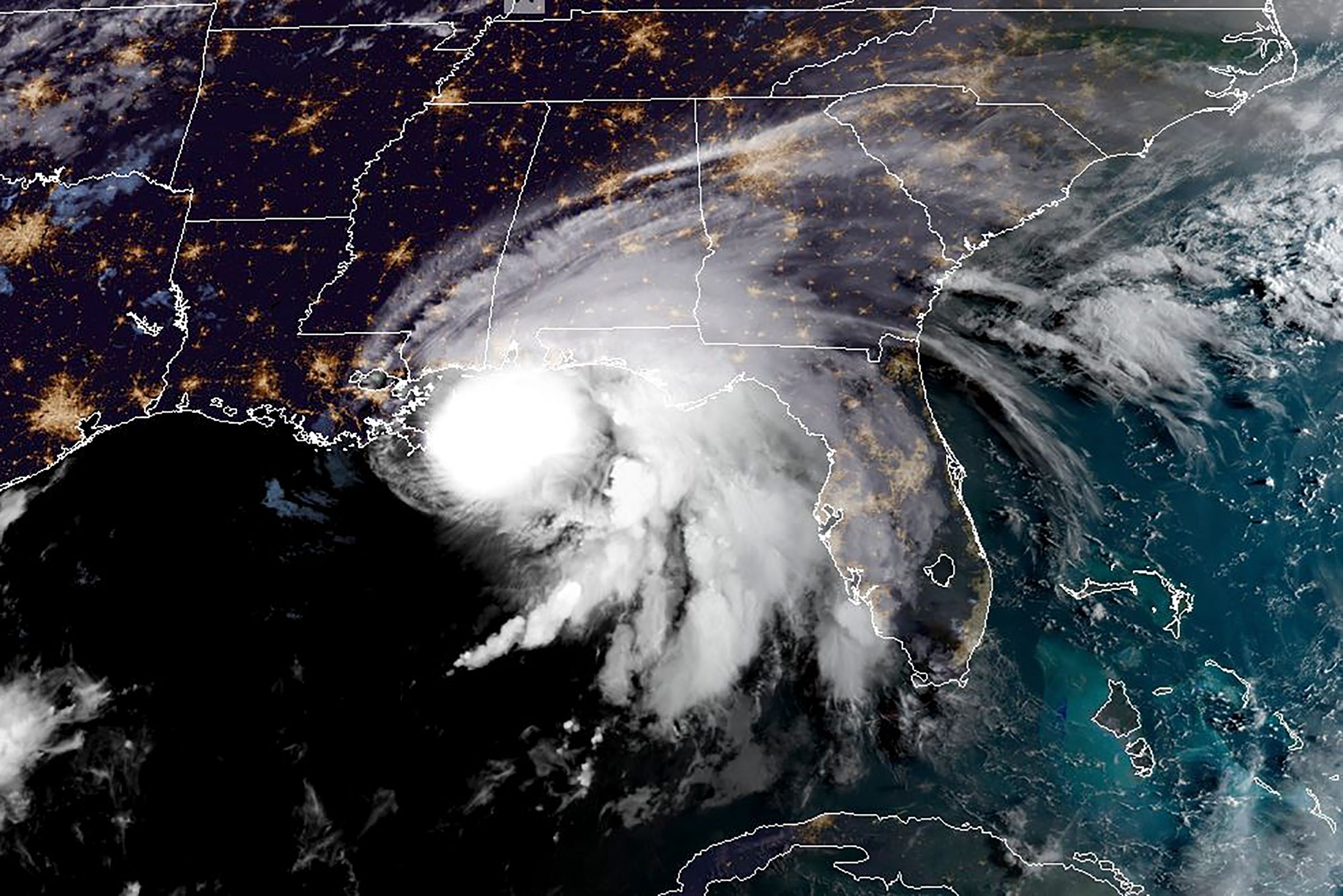 TOPSHOT - This RAMMB/NOAA satellite image shows Hurricane Sally off the US Gulf Coast on September 15, 2020, at 12:00 UTC. - Hurricane Sally is set to hit parts of the US Gulf Coast with rain for another day Tuesday before it makes landfall, raising fears that significant flooding is in store for coastal Mississippi, Alabama and the Florida Panhandle. The center of Sally -- a Category 1 storm with maximum sustained winds of 85 mph -- was moving over the Gulf of Mexico and toward coastal Mississippi only at 2 mph early Tuesday. (Photo by Handout / RAMMB/NOAA/NESDIS / AFP) / RESTRICTED TO EDITORIAL USE - MANDATORY CREDIT "AFP PHOTO / RAMMB/NOAA" - NO MARKETING - NO ADVERTISING CAMPAIGNS - DISTRIBUTED AS A SERVICE TO CLIENTS