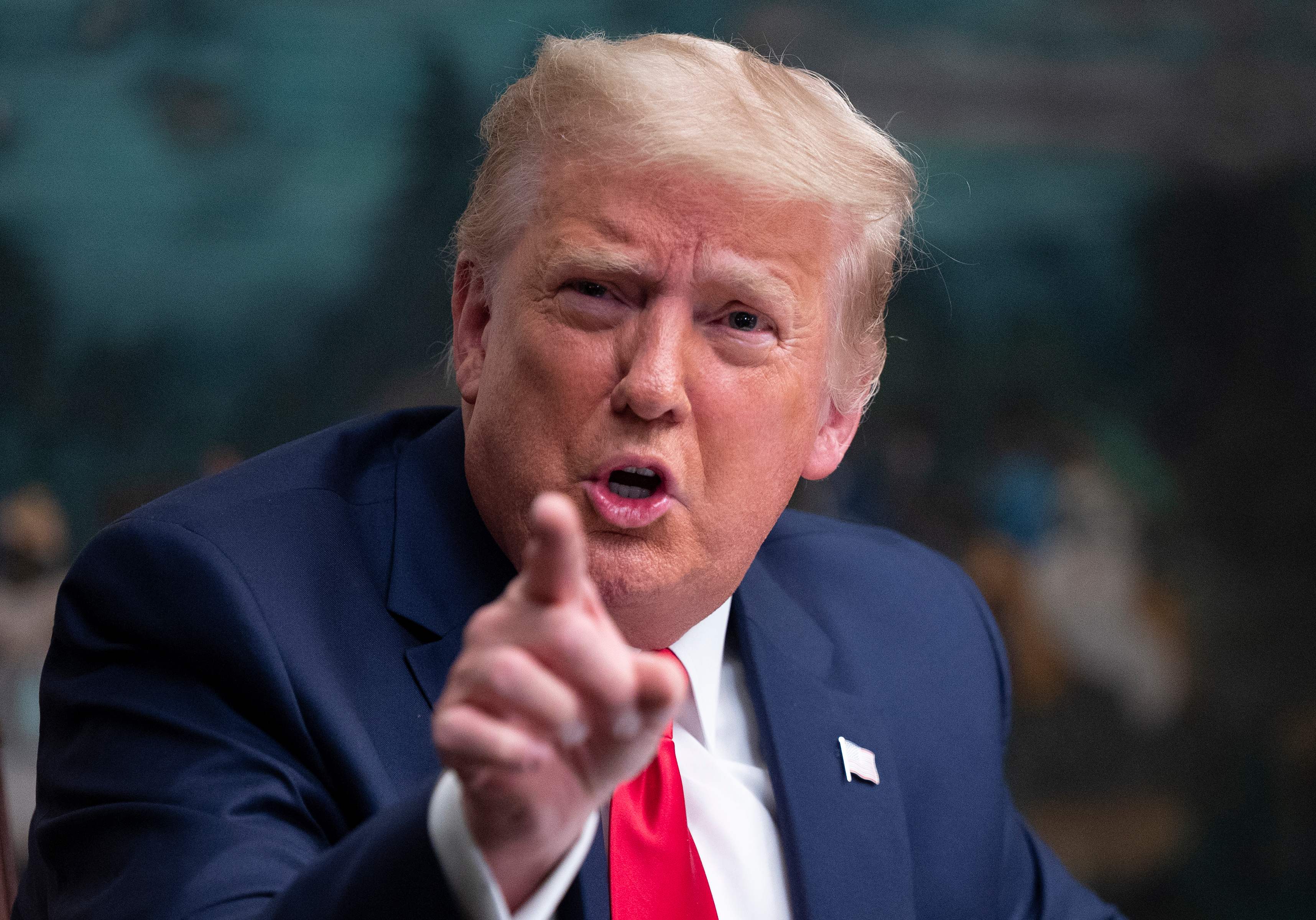 (FILES) In this file photo former US President Donald Trump speaks to reporters after participating in a Thanksgiving teleconference with members of the United States Military, at the White House in Washington, DC, on November 26, 2020. - YouTube has suspended Donald Trump indefinitely from the platform and said it will also prevent the former president's lawyer Rudy Giuliani from being able to monetize his clips, US media reported. It comes a week after the social media giant confirmed it would extend a ban on Trump's channel -- which has just under three million subscribers -- joining other social media platforms in banning his accounts following the deadly January 6, 2021 Capitol riot. (Photo by ANDREW CABALLERO-REYNOLDS / AFP)