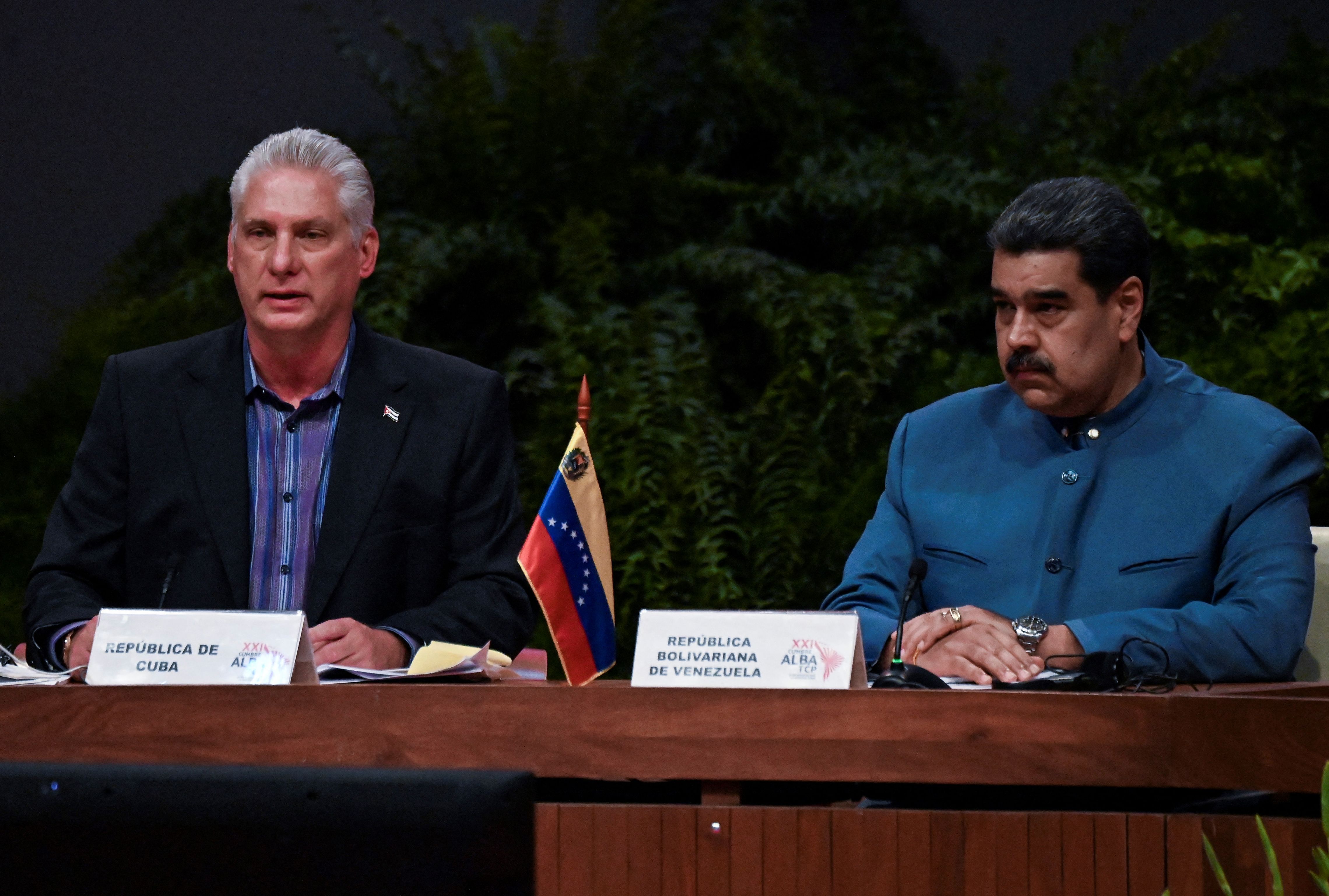 Cuba's President Miguel Diaz Canel (L) speaks next to Venezuelan President Nicolas Maduro during the XXI Summit of the Bolivarian Alliance for the Peoples of Our America-People's Trade Agreement (ALBA-TCP), at the Palace of the Revolution in Havana on May 27, 2022. (Photo by YAMIL LAGE / POOL / AFP)