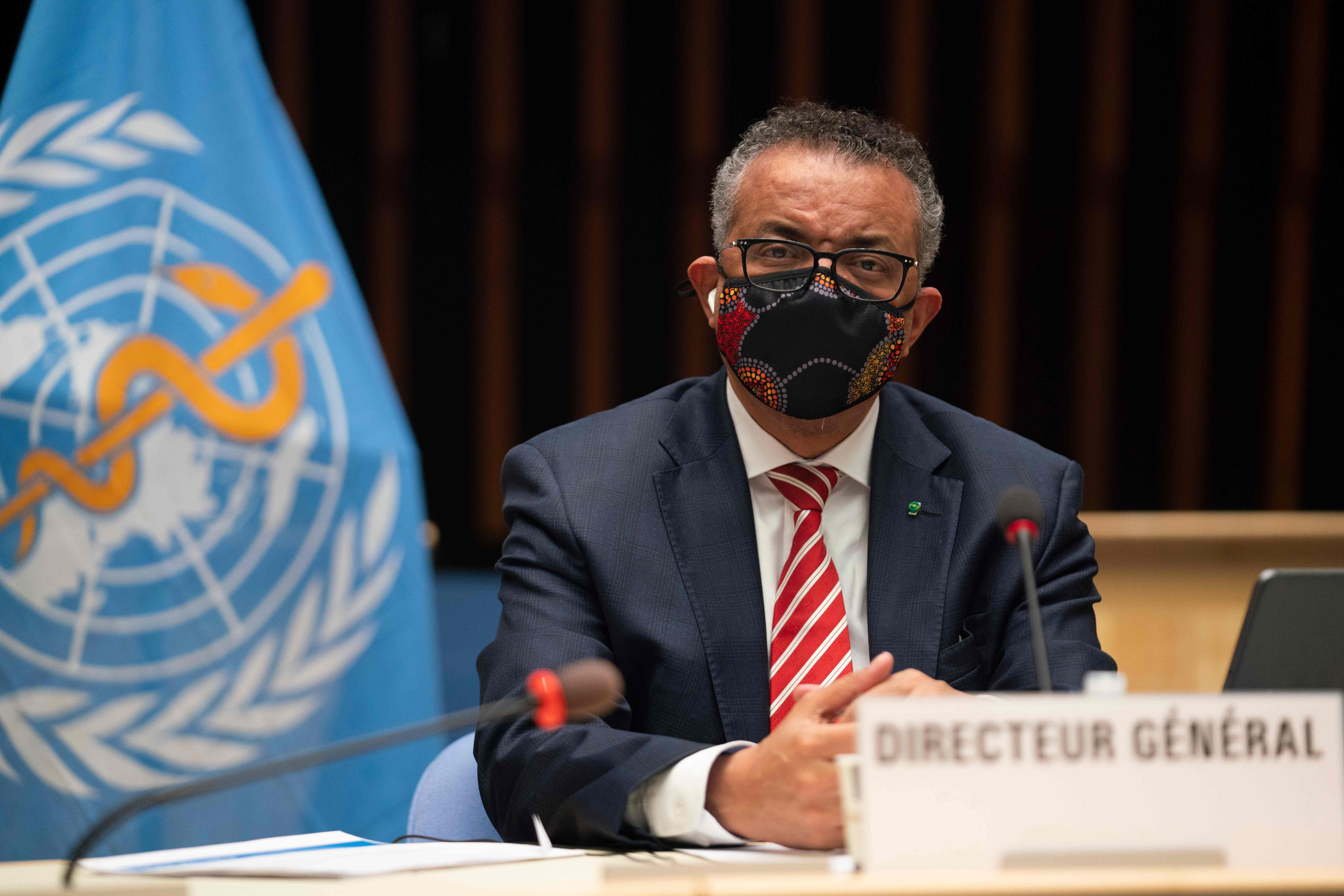 This handout picture taken and released by the World Health Organization on October 5, 2020 shows World Health Organization (WHO) Director-General Tedros Adhanom Ghebreyesus wearing a protective face mask attending a WHO executive board holds special session on the Covid-19 response at the health agency's hesdquarters in Geneva. - The WHO estimated Monday that 10 percent of the world has been infected by the new coronavirus -- way more than has been recorded -- as it mulled speeding up internal reforms. (Photo by Christopher Black / World Health Organization / AFP) / RESTRICTED TO EDITORIAL USE - MANDATORY CREDIT "AFP PHOTO / WORLD HEALTH ORGANIZATION / CHRISTOPHER BLACK" - NO MARKETING NO ADVERTISING CAMPAIGNS - DISTRIBUTED AS A SERVICE TO CLIENTS