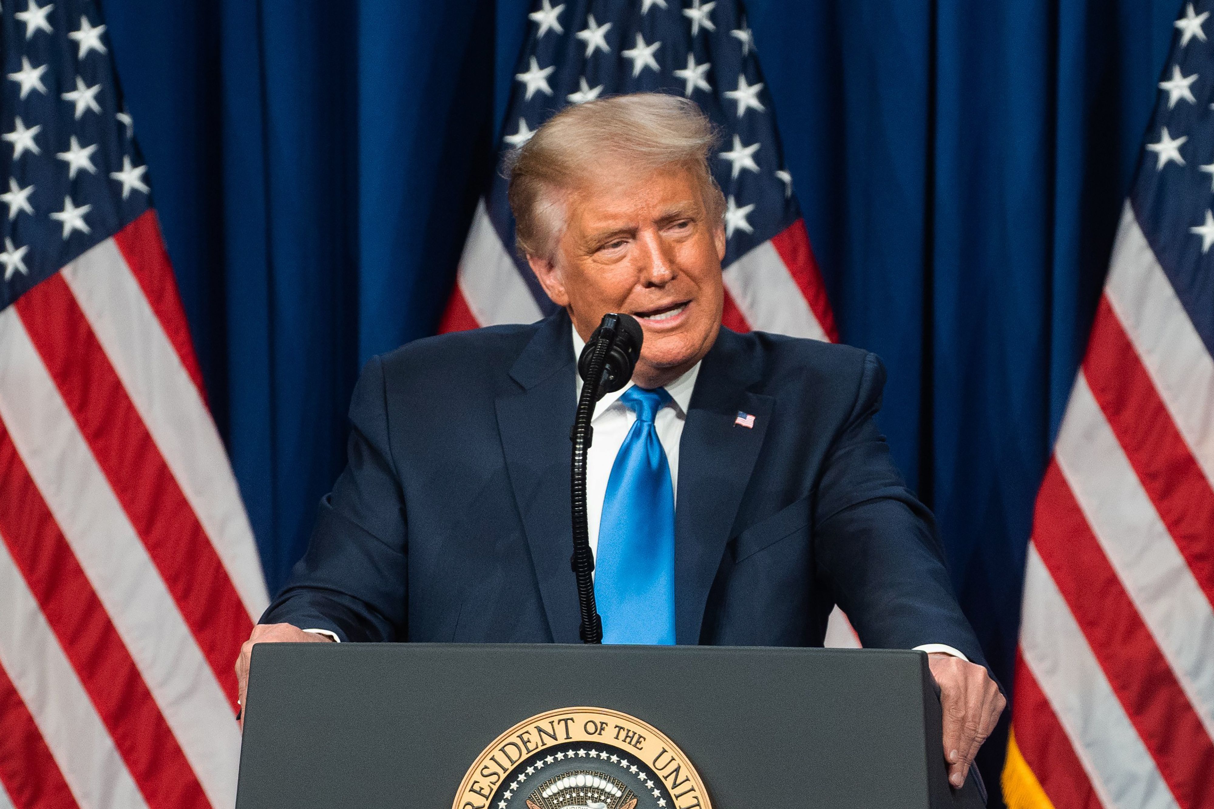 US President Donald Trump speaks during the first day of the Republican National Convention on August 24, 2020, in Charlotte, North Carolina. - President Donald Trump went into battle for a second term Monday with his nomination at a Republican convention where he will draw on all his showman's instincts to try and change the narrative in an election he is currently set to lose. (Photo by Jessica KOSCIELNIAK / POOL / AFP)