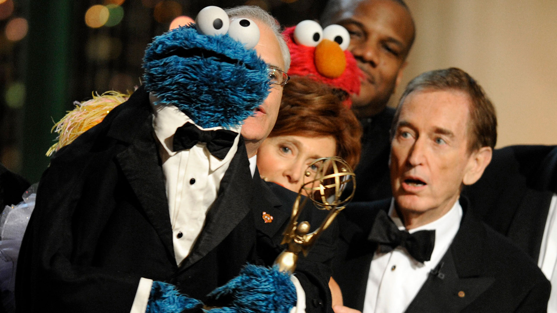 FILE - Bob McGrath, right, looks up at Cookie Monster as they accept the Lifetime Achievement Award for '"sesame street" at the Daytime Emmy Awards on August 30, 2009 in Los Angeles.  (AP Photo/Chris Pizzello, File)
