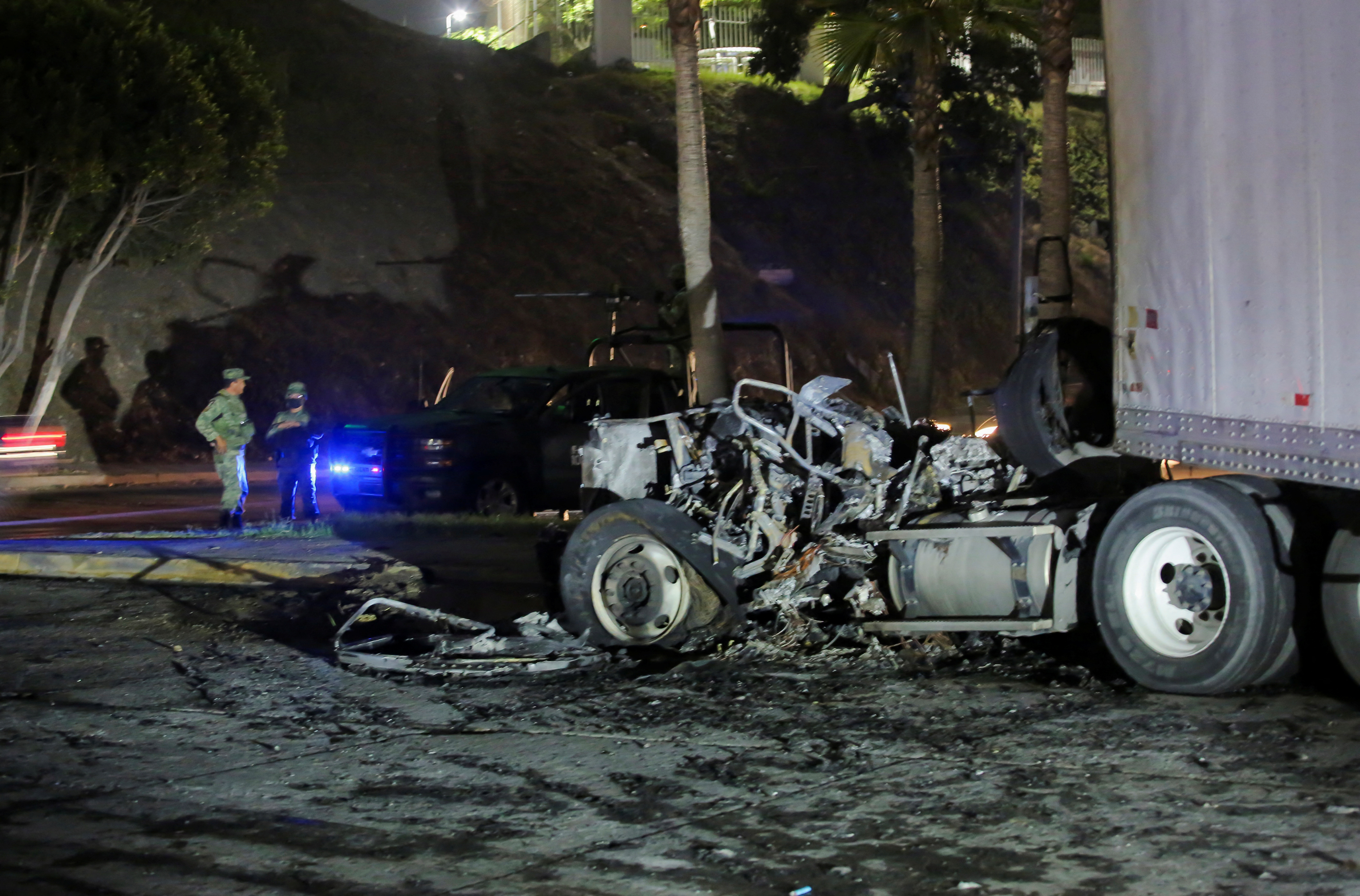 A view shows burnt vehicles after they were set on fire by unidentified individuals in Tijuana