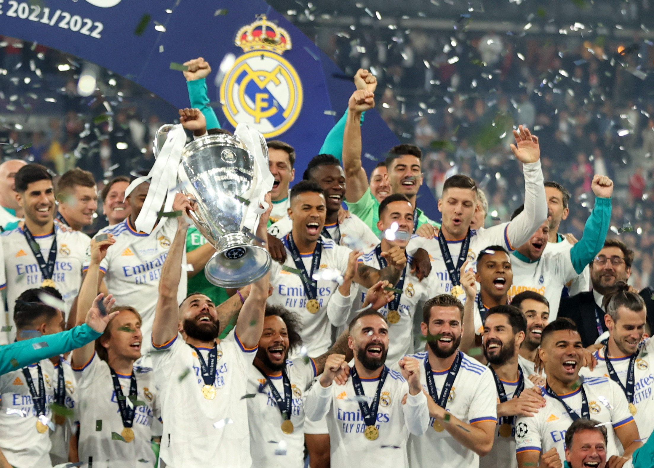 Soccer Football - Champions League Final - Liverpool v Real Madrid - Stade de France, Saint-Denis near Paris, France - May 28, 2022 Real Madrid's Karim Benzema celebrates winning the champions league with the trophy and teammates REUTERS/Molly Darlington