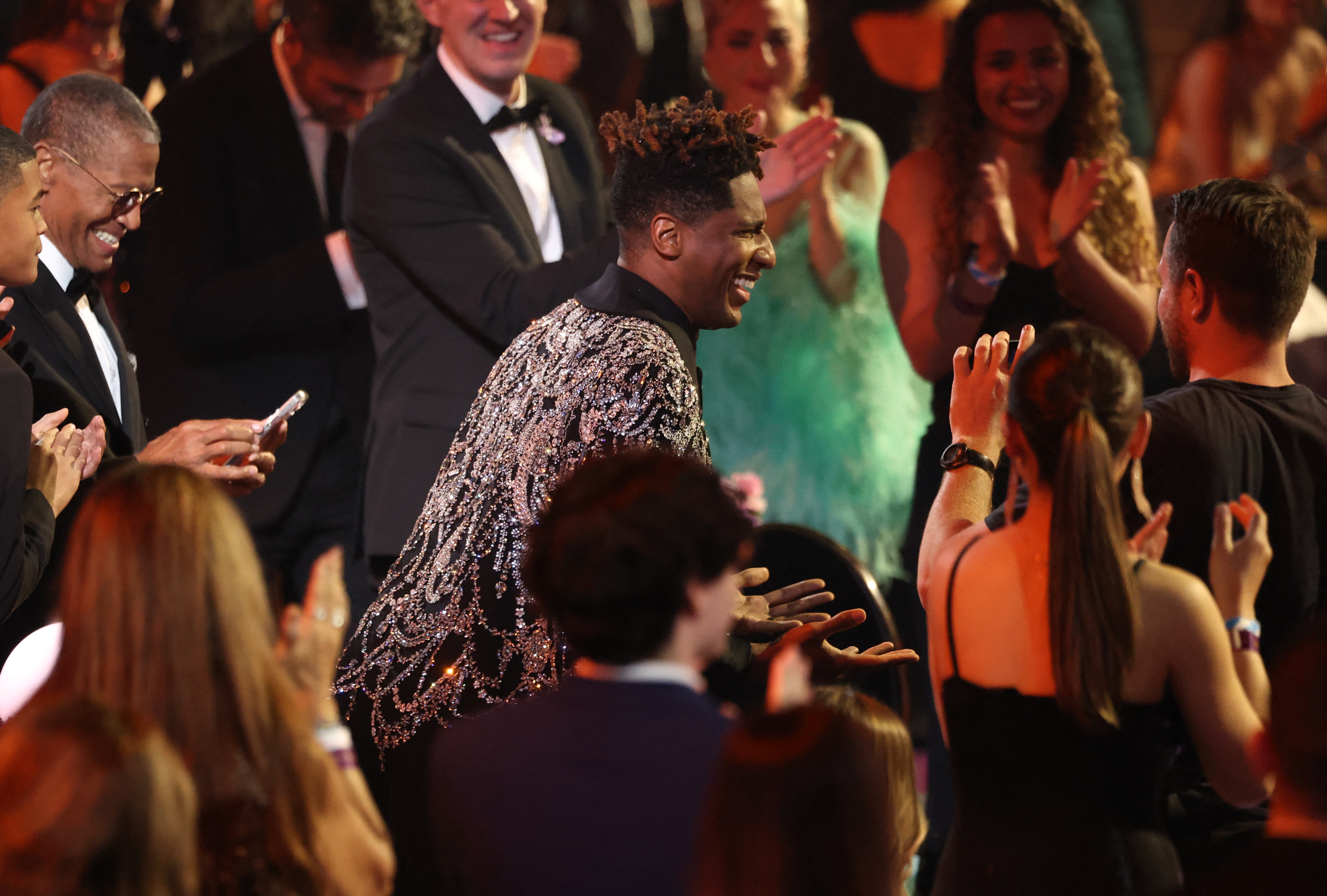 Jon Batiste reacts in the audience as he wins the Grammy award for Album of the Year for "We Are" during the 64th Annual Grammy Awards show in Las Vegas, Nevada, U.S., April 3, 2022.  REUTERS/Mario Anzuoni