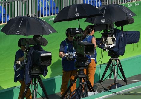 Olympic Broadcasting Services (OBS) camera people film the women's third round singles tennis match between Russia's Svetlana Kuznetsova and Britain's Johanna Konta at the Olympic Tennis Centre of the Rio 2016 Olympic Games in Rio de Janeiro on August 9, 2016. / AFP / Roberto SCHMIDT        (Photo credit should read ROBERTO SCHMIDT/AFP/Getty Images)