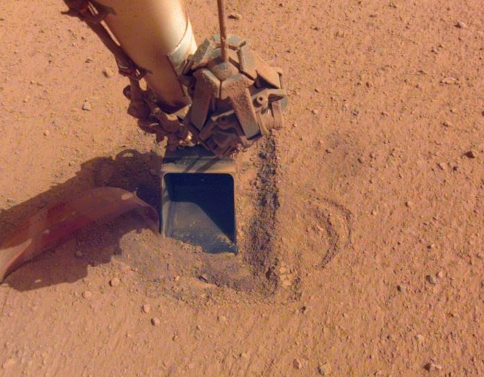 The probe to study Mars' internal heat aboard NASA's InSight lander has ended its mission, not getting the friction it needs to dig.  (NASA/JPL-CALTECH)