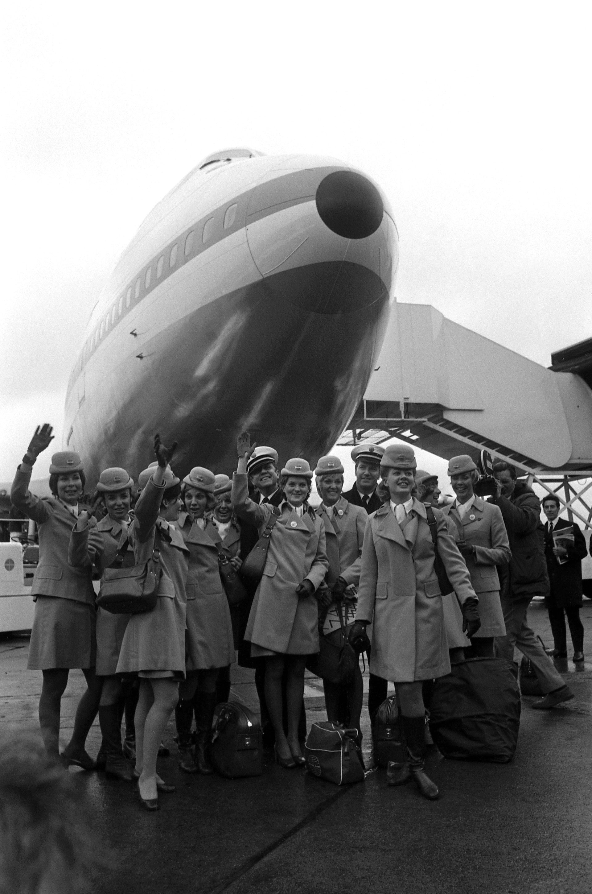 The crew of a Boeing 747 Jumbo Jet pose in front of the plane's nose at London's Heathrow Airport in England on January 12, 1970. This 360-seat aircraft was the first of its kind to complete a transatlantic crossing.  AP/File