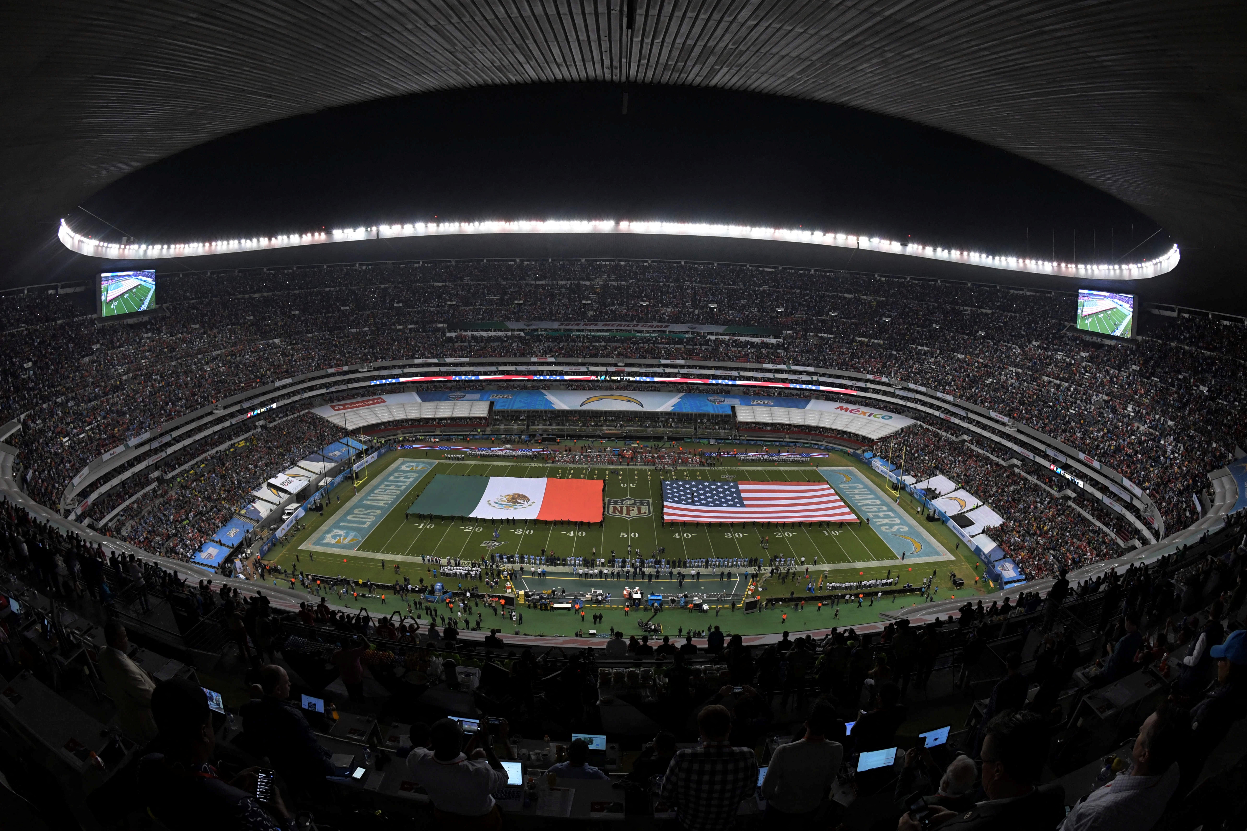 FILE PHOTO: General view of Estadio Azteca with United States and Mexican flags on the field during the playing of the national anthem before the NFL International Series game between the Kansas City Chiefs and the Los Angeles Chargers in Mexico City, Mexico November 18, 2019. Mandatory Credit: Kirby Lee-USA TODAY Sports via REUTERS/File Photo