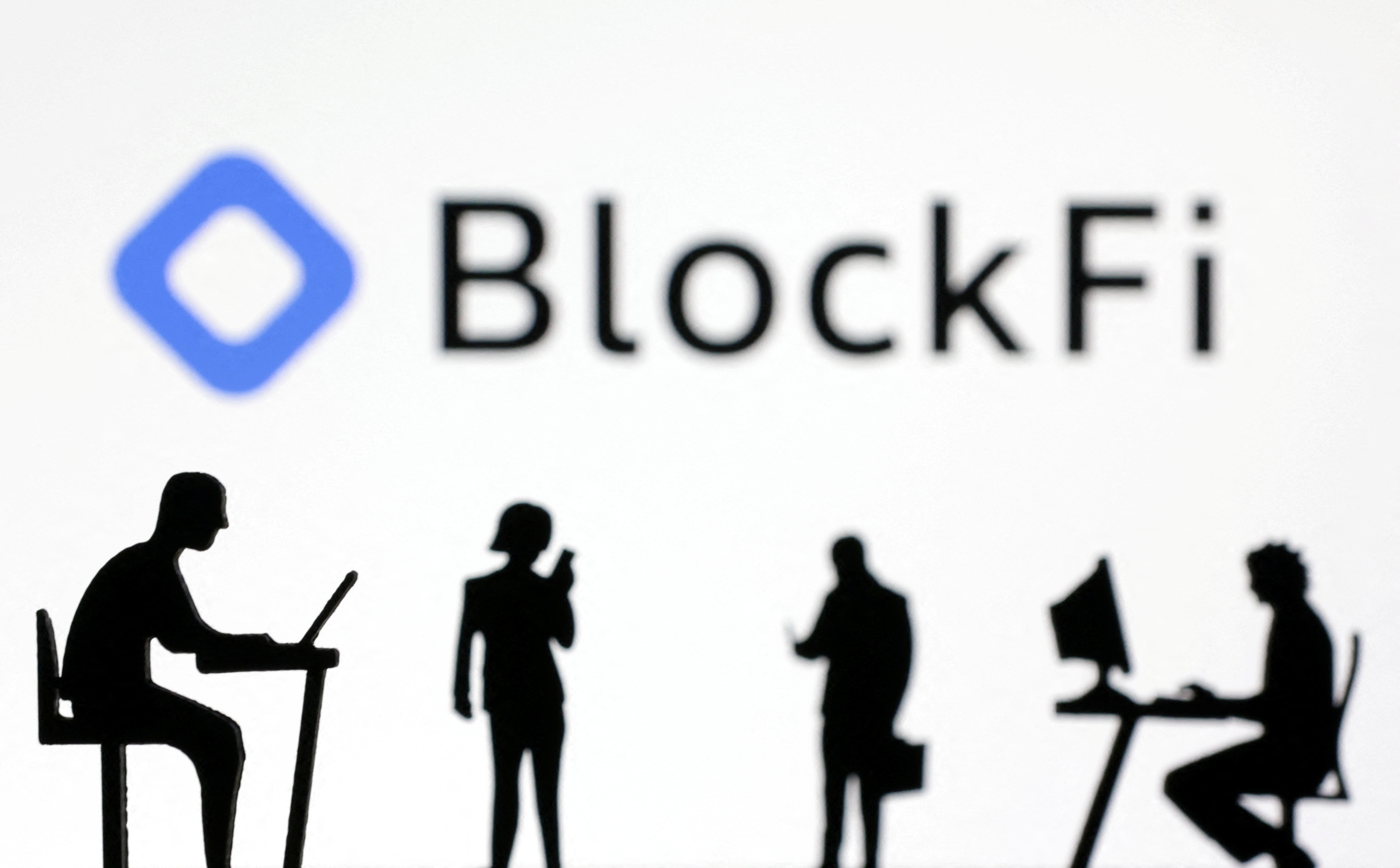 Figurines with smartphones and computers are seen in front of the BlockFi logo in this illustration, November 28, 2022. REUTERS/Dado Ruvic/Illustration