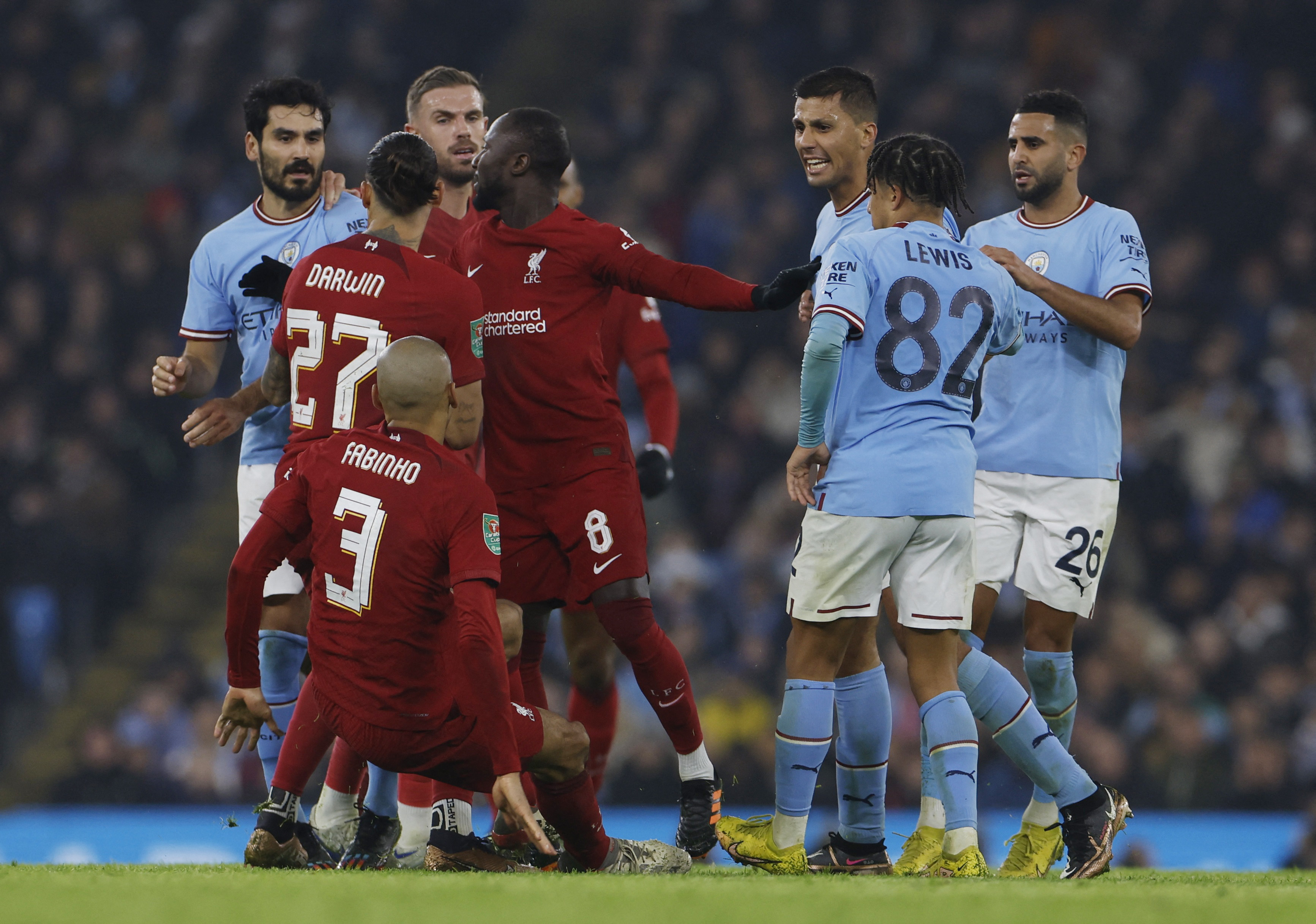 Soccer Football - Carabao Cup - Round of 16 - Manchester City v Liverpool - Etihad Stadium, Manchester, Britain - December 22, 2022 Liverpool's Fabinho clashes with Manchester City's Rodri as Ilkay Gundogun, Riyad Mahrez, Liverpool's Jordan Henderson, Darwin Nunez, Naby Keita and teammates look on Action Images via Reuters/Jason Cairnduff EDITORIAL USE ONLY.  Do not use with unauthorized audio, video, data, fixture lists, club/league logos or 'live' services.  Online in-match use limited to 75 images, no video emulation.  Do not use in betting, games or single club/league/player publications.  Please contact your account representative for further details.