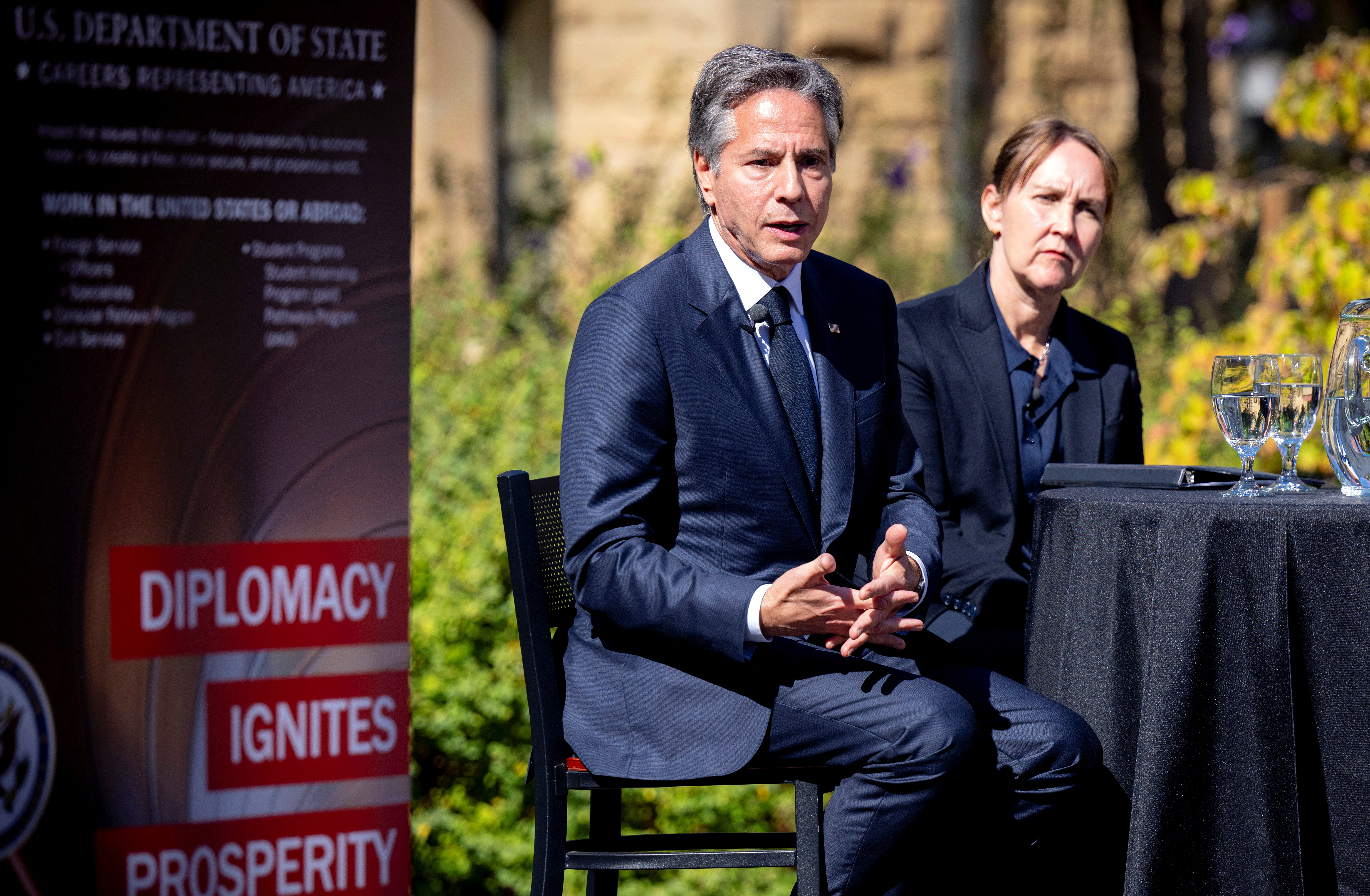 US Secretary of State Antony Blinken (L) delivers remarks during a recruiting event at Stanford Law School in Stanford, California