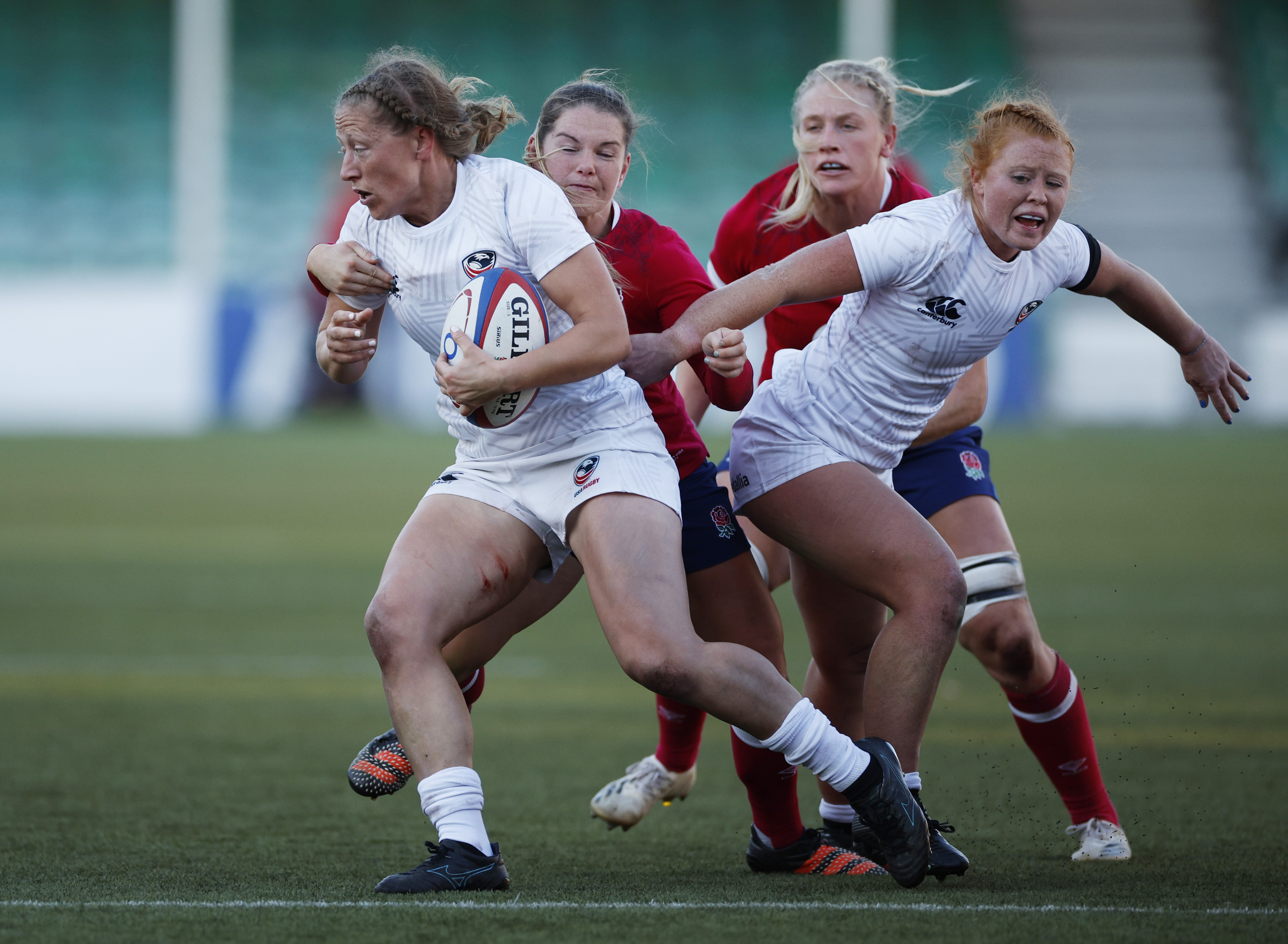 Rugby Union - Women's International - England v United States - Sixways Stadium, Worcester, Britain - November 21, 2021 United States' Kate Zackary is tackled by England's Leanne Infante Action Images via Reuters/John Sibley