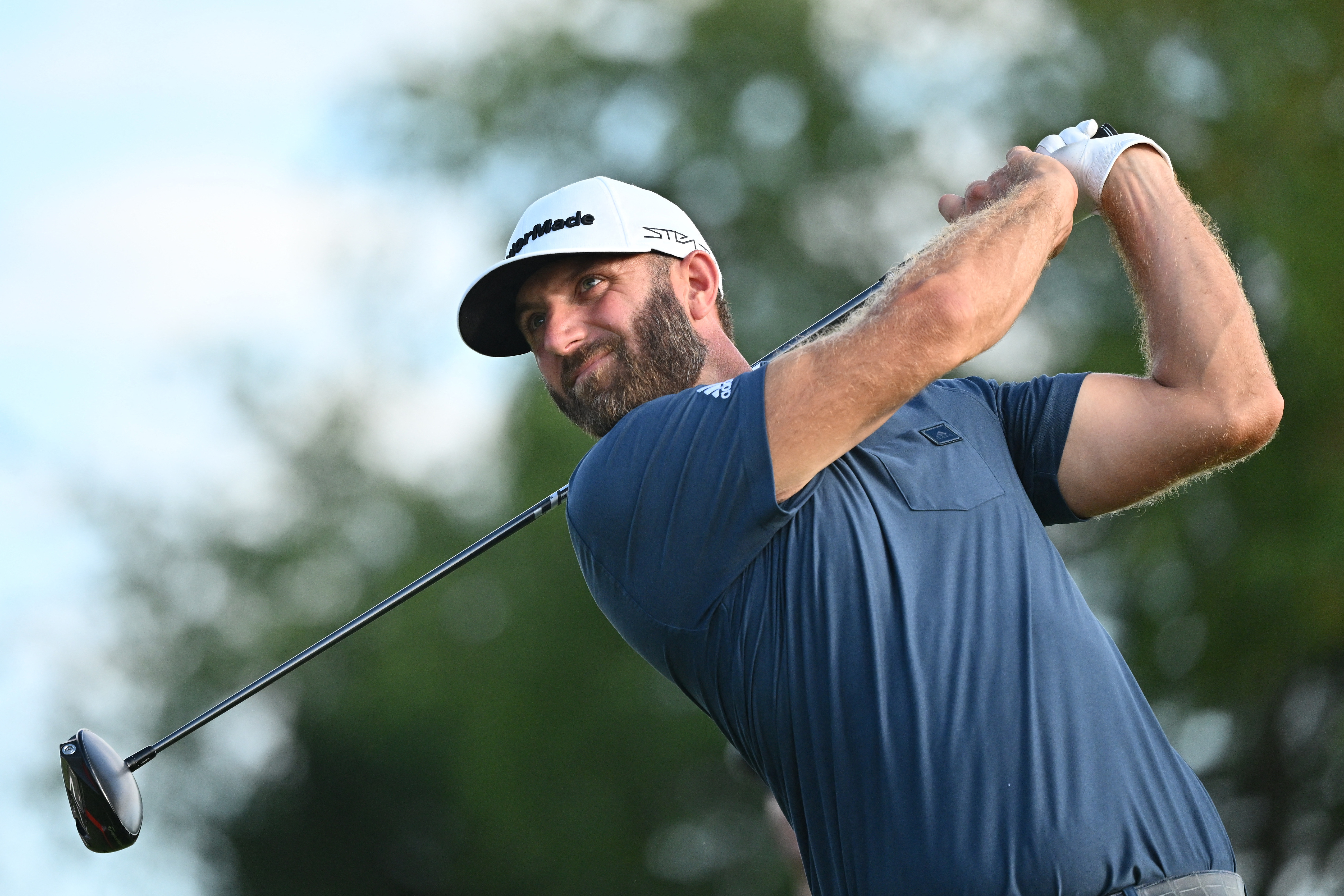 Sep 18, 2022; Chicago, Illinois, USA; Dustin Johnson tees off from the 18th tee box during the final round of the Invitational Chicago LIV Golf tournament at Rich Harvest Farms. Mandatory Credit: Jamie Sabau-USA TODAY Sports