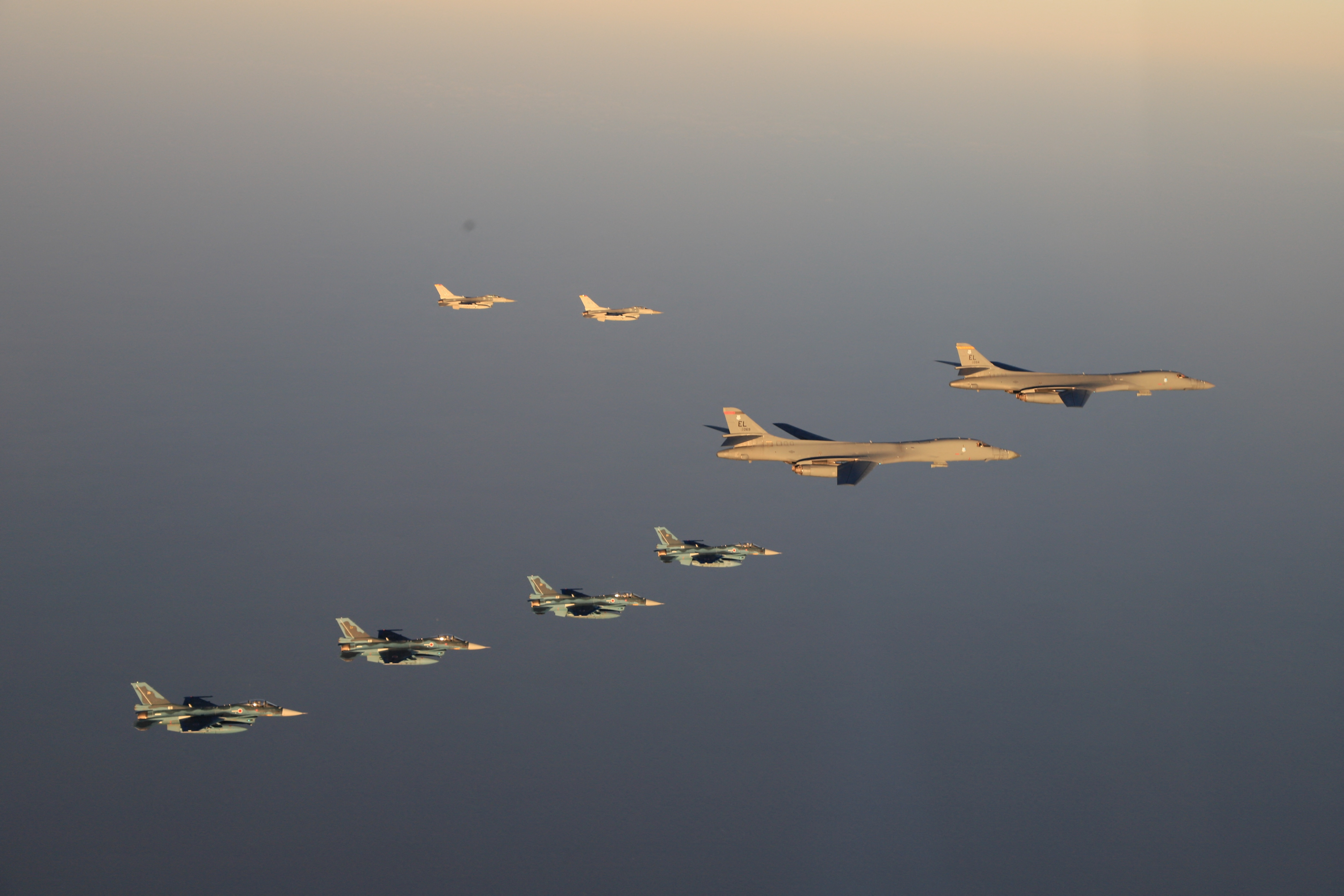 F-2 fighters from the 8th Air Wing of the Japan Air Self-Defense Force conduct a joint military drill with B-1B bombers from the US 28th Bomb Wing and F-16 fighters from the 35th Bomb Wing Fighter aircraft off Japan's southernmost main island, Kyushu, Japan, in this handout photo taken by the Japan Air Self-Defense Force and released by the Japan Ministry of Defense Joint Chiefs of Staff Office.  Japan Ministry of Defense Office of the Joint Chiefs of Staff/HANDOUT via REUTERS 