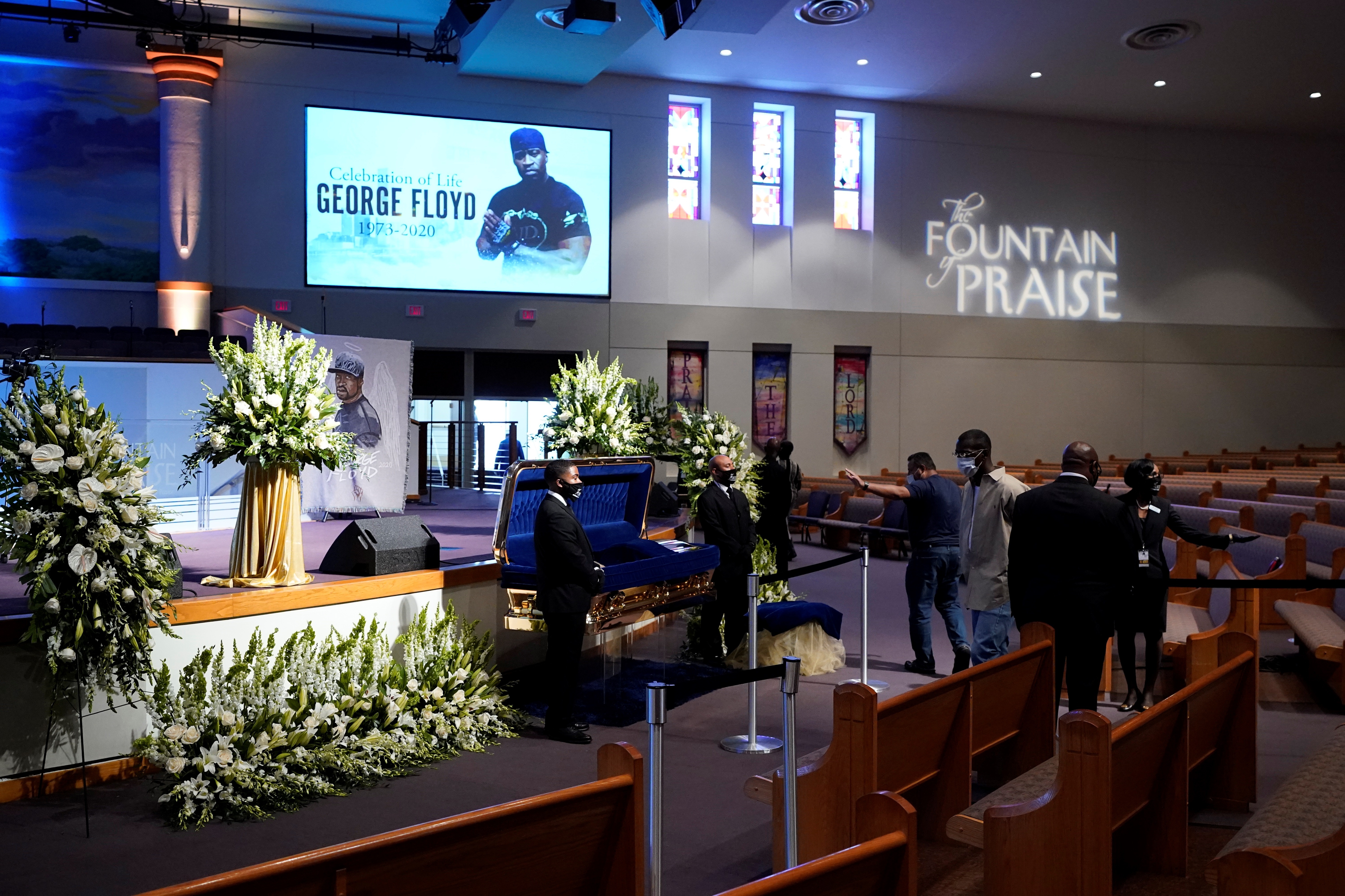 Mourners pass the casket of George Floyd during a public visitation for Floyd at the Fountain of Praise church, in Houston, Texas, USA, 08 June 2020. EFE/David J. Phillip
