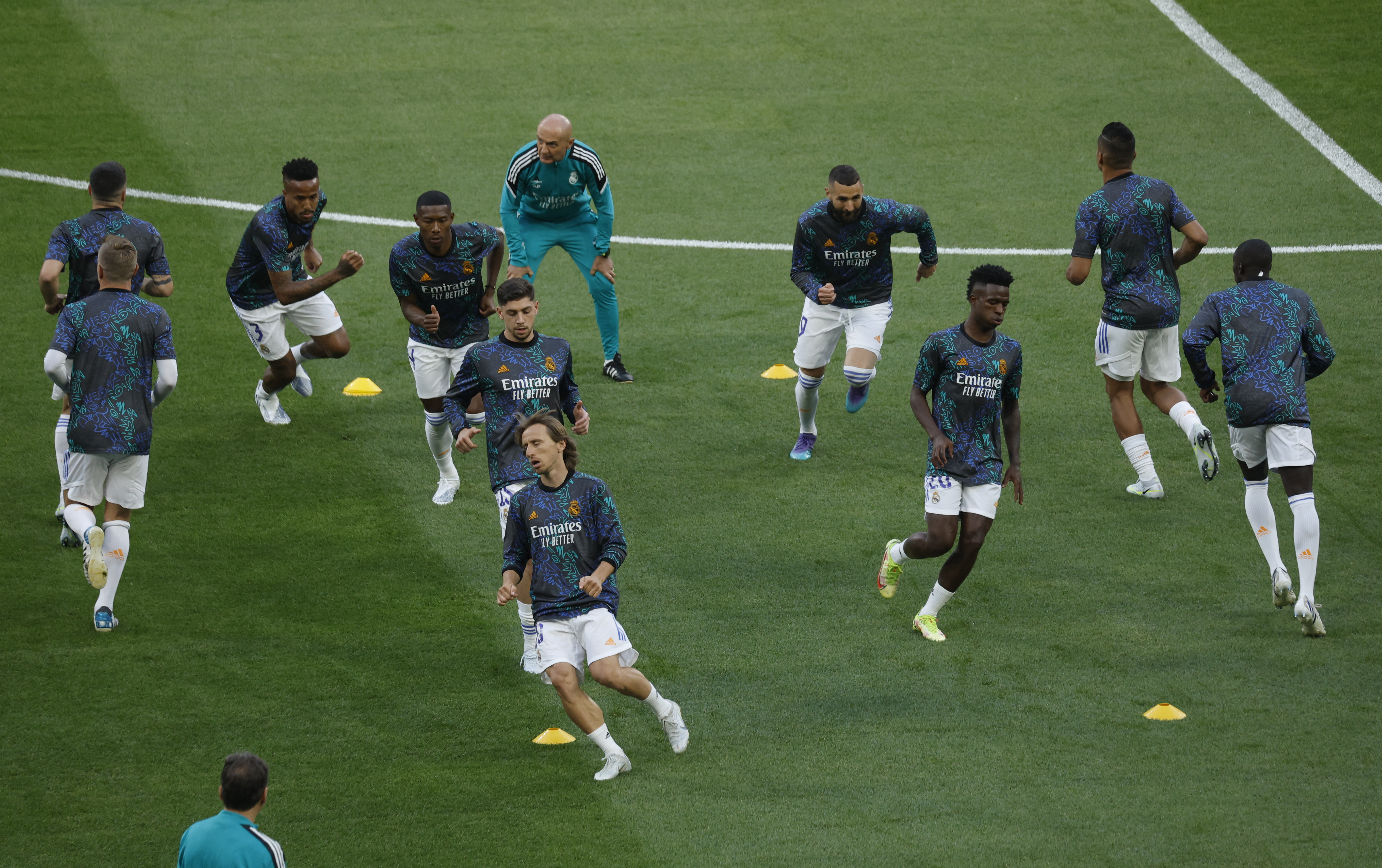Soccer Football - Champions League Final - Liverpool v Real Madrid - Stade de France, Saint-Denis near Paris, France - May 28, 2022  Real Madrid's Luka Modric and Vinicius Junior with teammates during the warm up before the match REUTERS/Gonzalo Fuentes