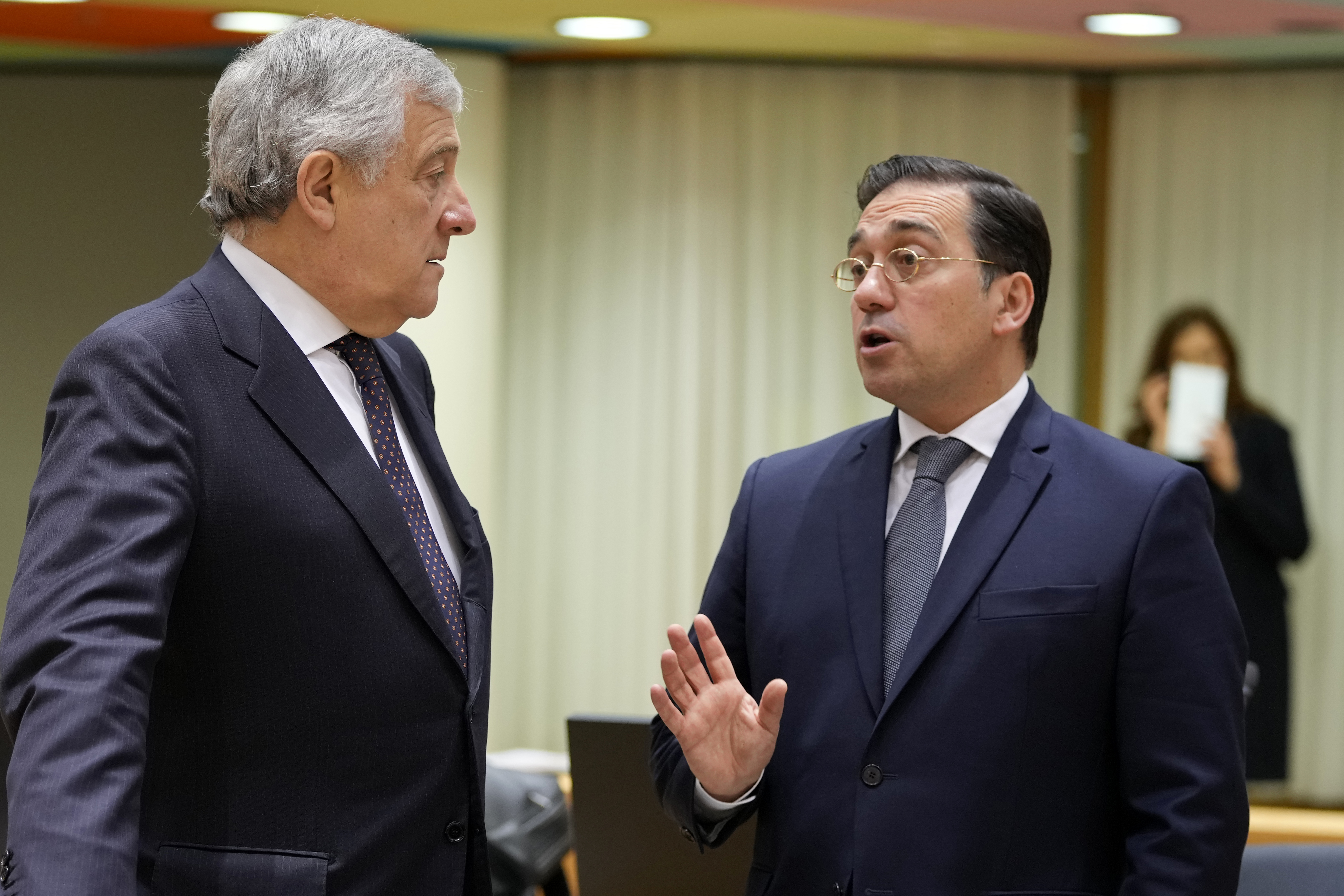 Spanish Foreign Minister José Manuel Albares Bueno, right, talks with his Italian counterpart Antonio Tajani during a meeting between EU foreign ministers in Brussels, Monday, Feb. 20, 2023. (AP Photo/Virginia Mayo)