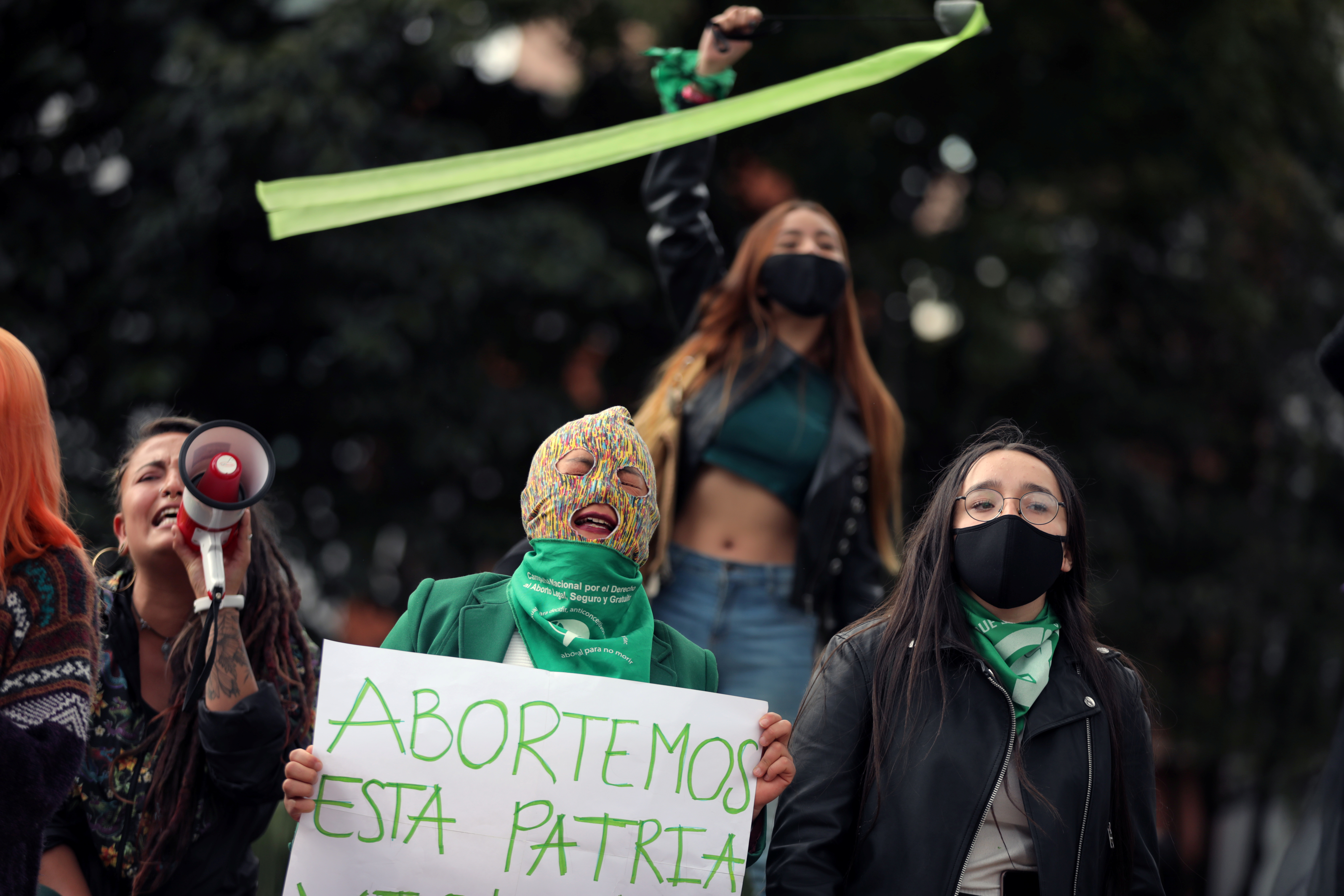 Demonstrators and activists take part in a rally in support of legal and safe abortion during a march to mark the International Safe Abortion Day in Bogota, Colombia September 28, 2020. Placard reads "let's abort this violent homeland". REUTERS/Luisa Gonzalez