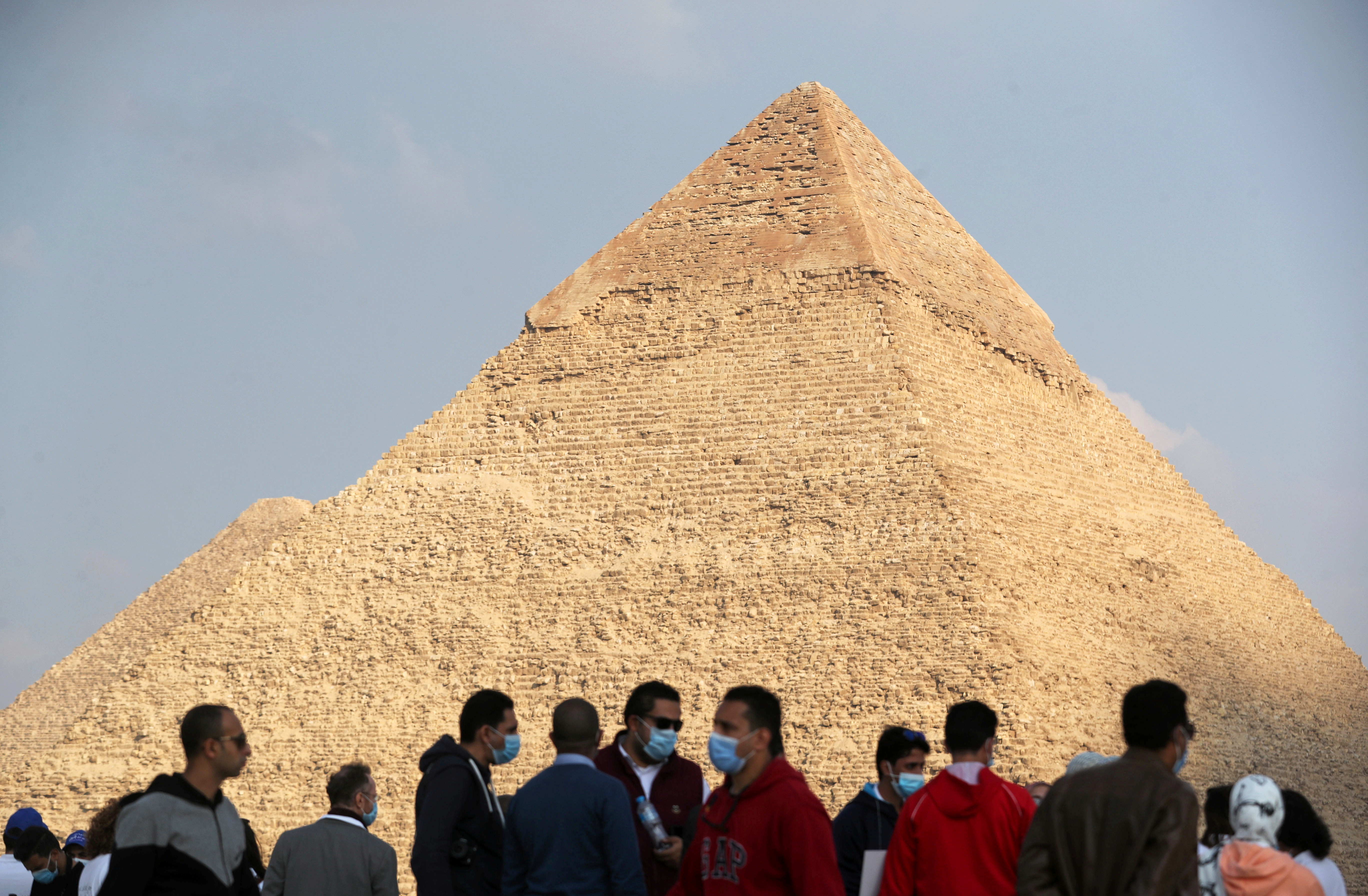 Visitors gather at the Great Pyramids of Giza in Giza, Egypt December 18, 2020. REUTERS/Mohamed Abd El Ghany