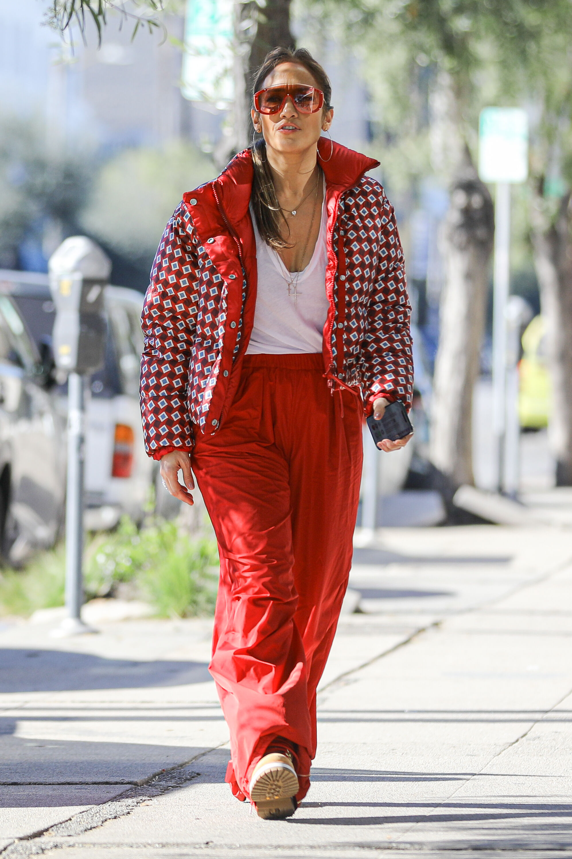 All in red!  Jennifer Lopez dressed in a Christmas look as she went shopping with her mom Guadalupe and her sister Linda
