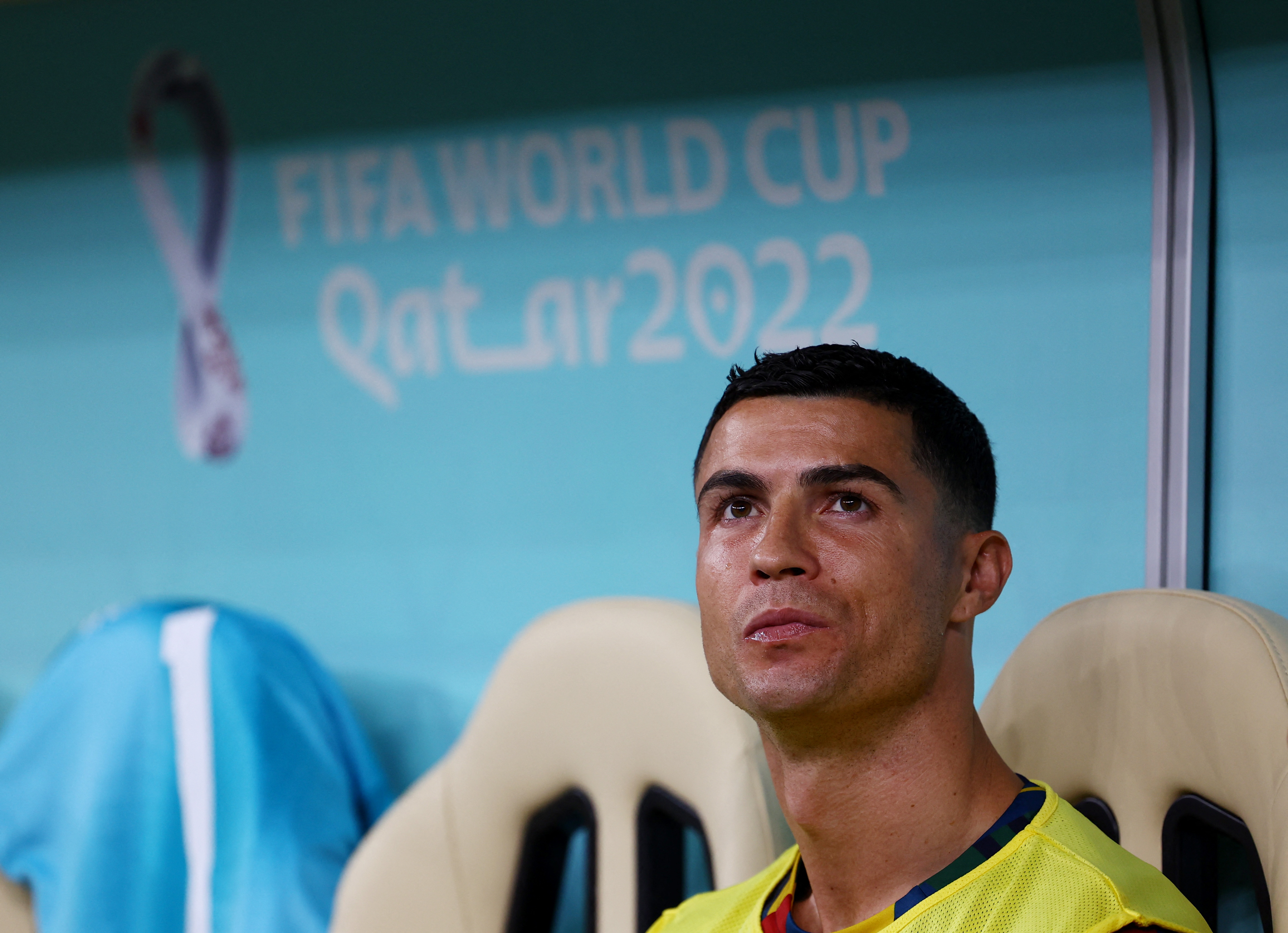 Soccer Football - FIFA World Cup Qatar 2022 - Round of 16 - Portugal v Switzerland - Lusail Stadium, Lusail, Qatar - December 6, 2022 Portugal's Cristiano Ronaldo on the substitutes bench before the match REUTERS/Kai Pfaffenbach