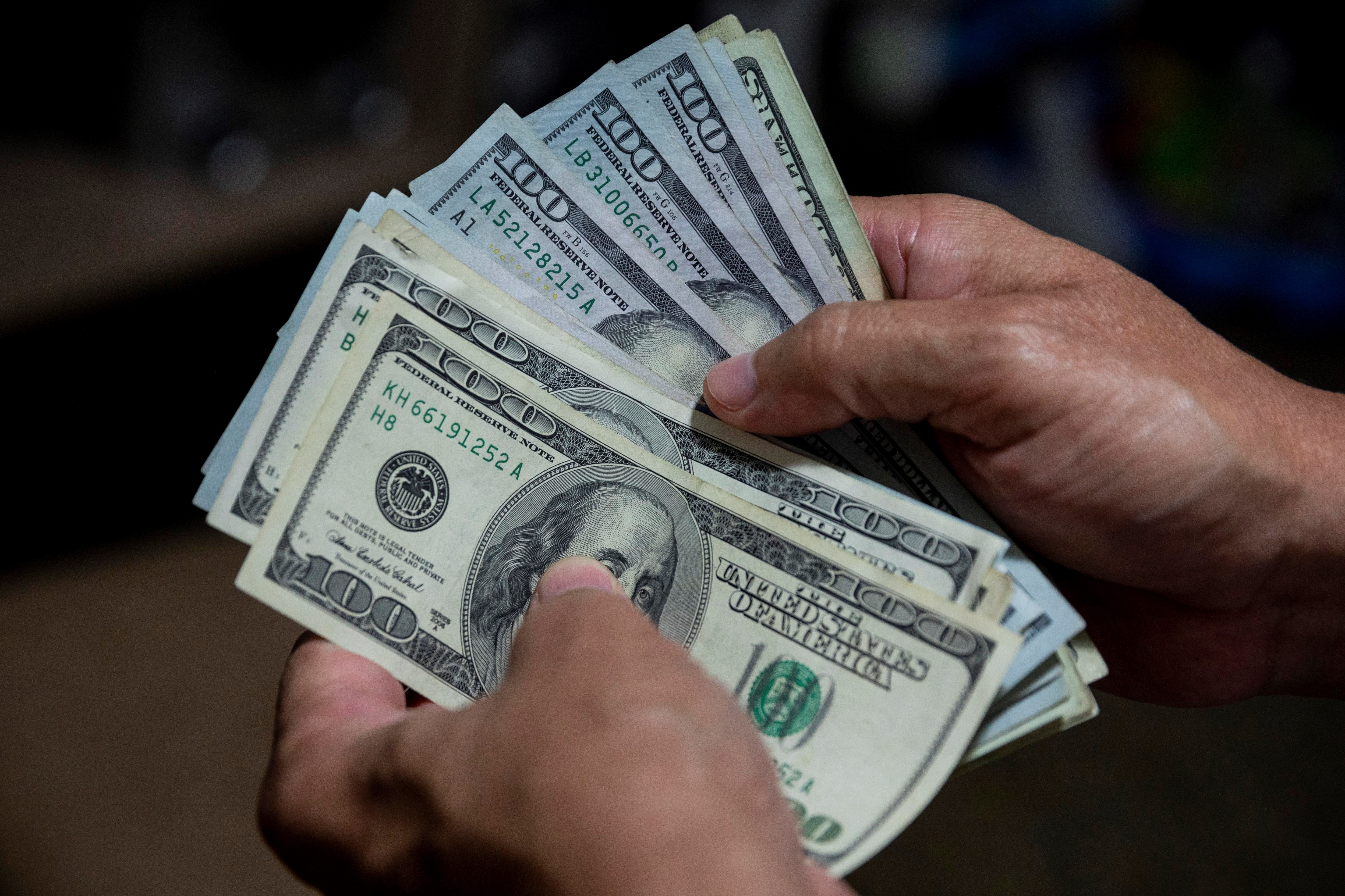 File photo of a bundle of dollar bills.  EFE / Rayner Peña R.
