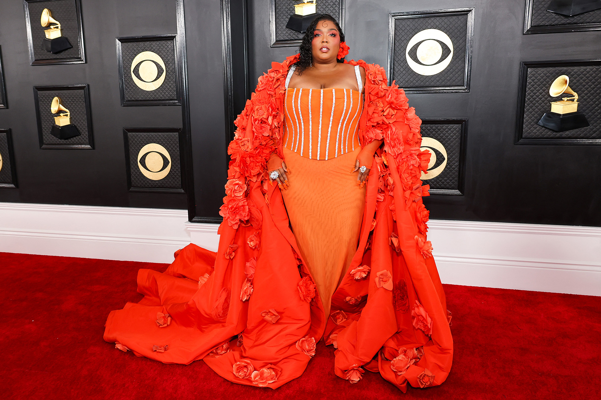 Lizzo opted for an electrifying orange look (AFP)