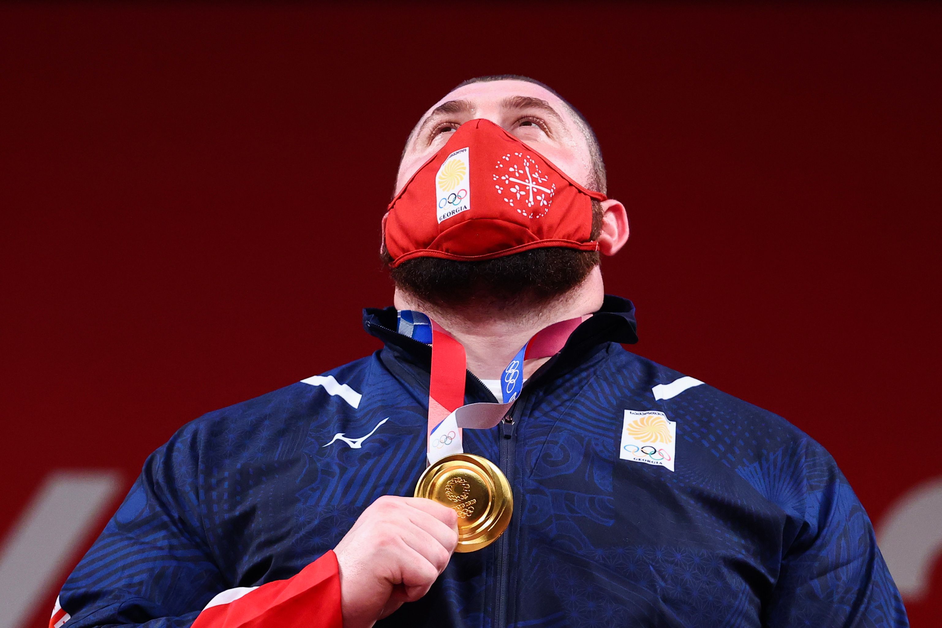 Tokyo 2020 Olympics - Weightlifting - Men's +109kg - Medal Ceremony - Tokyo International Forum, Tokyo, Japan - August 4, 2021. Gold medalist Lasha Talakhadze of Georgia reacts. REUTERS/Edgard Garrido