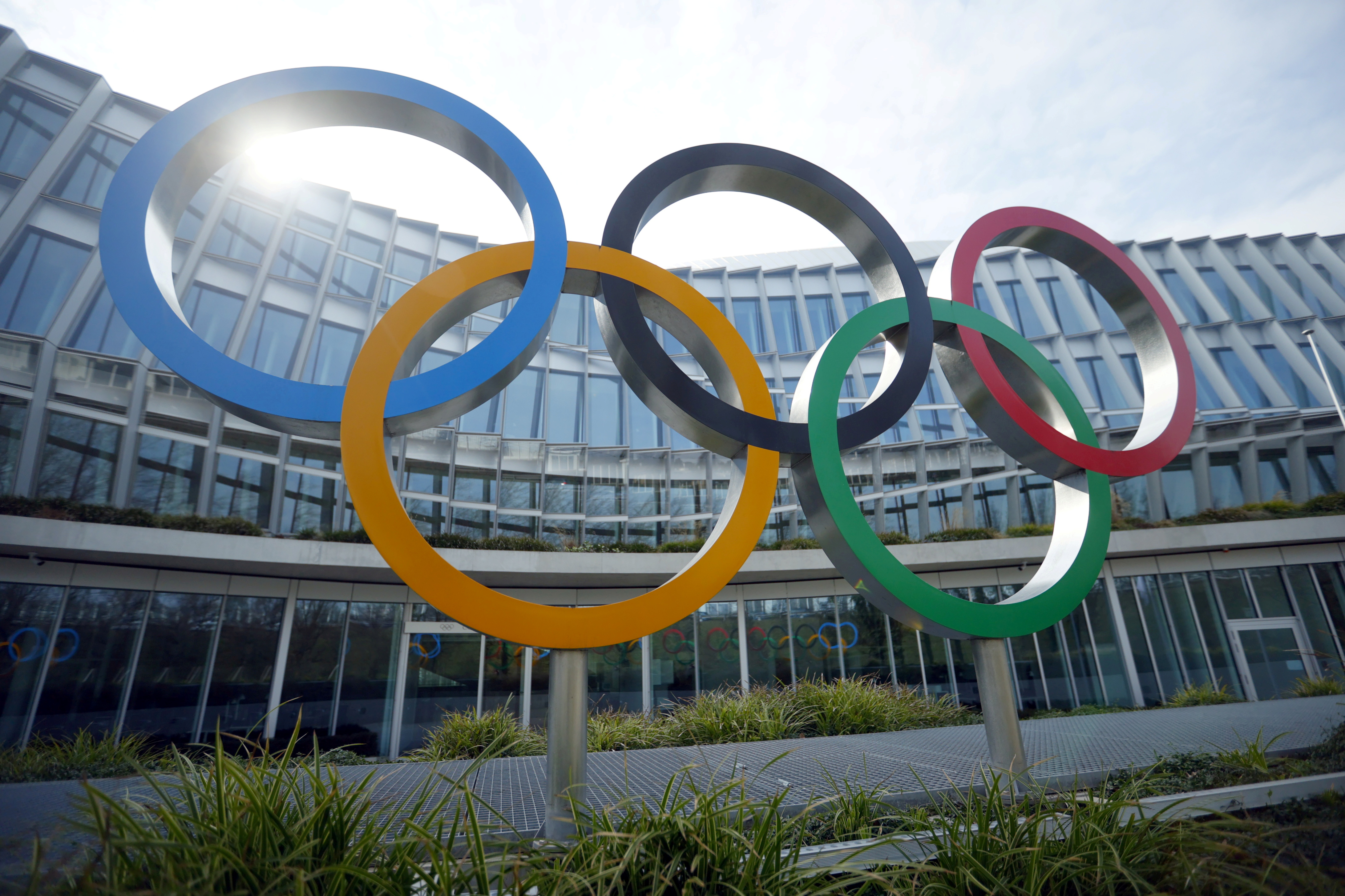 FILE PHOTO: The Olympic rings are pictured in front of the International Olympic Committee (IOC) headquarters in Lausanne, Switzerland, March 9, 2021. REUTERS/Denis?Balibouse/File Photo